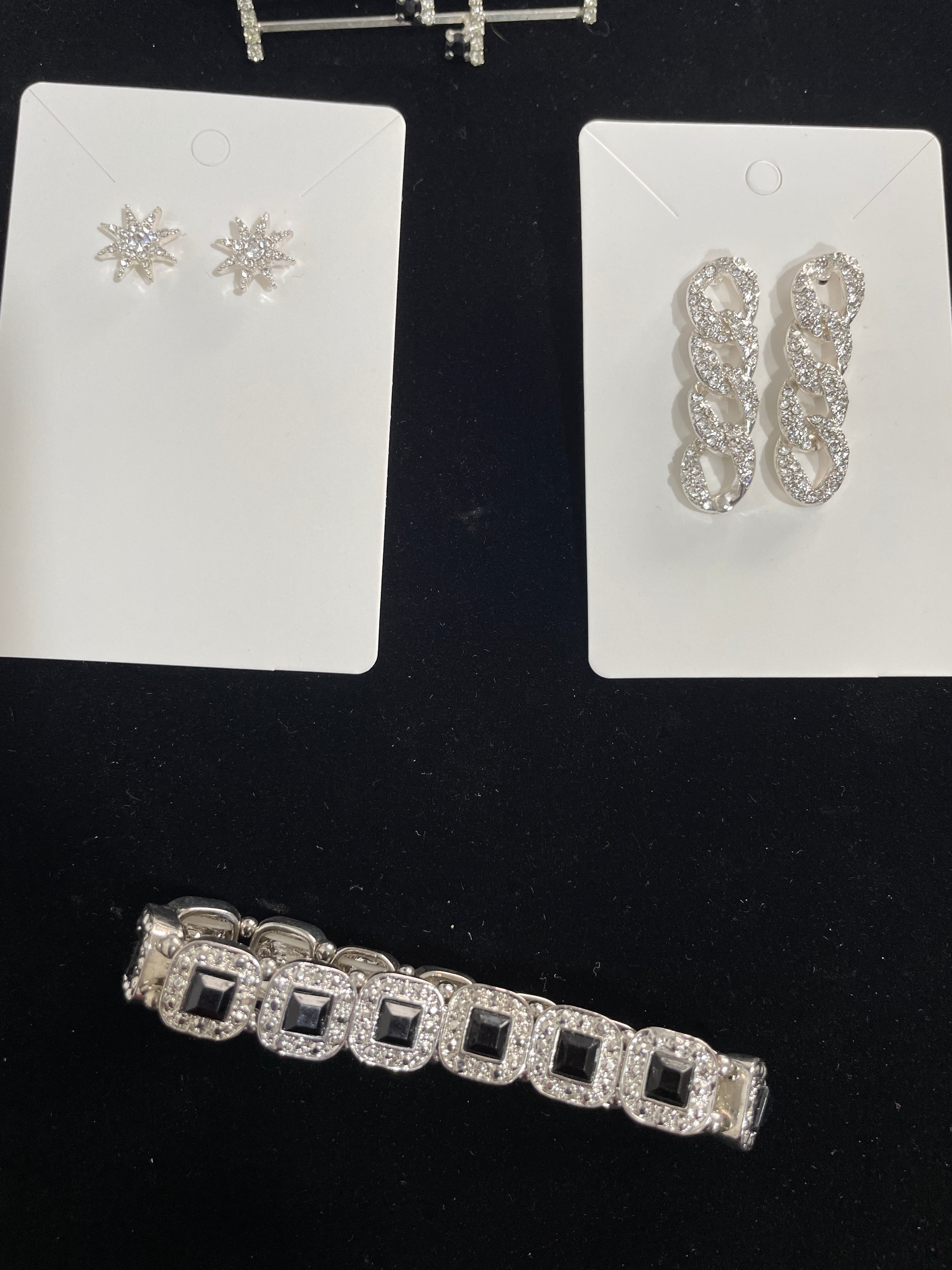 Rhinestone costume jewellery with two pairs of earrings and elastic stretch bracelet with black stones
