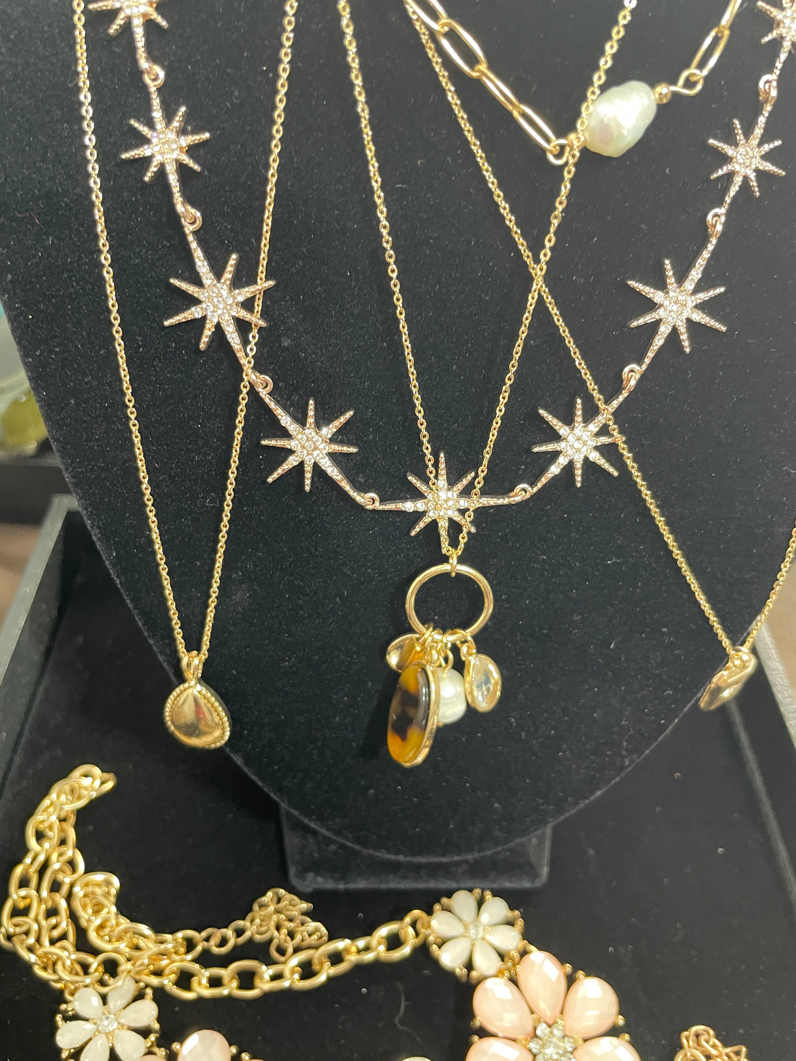 Gold tone costume necklaces with rhinestone starbursts charms faux pearl and pendant details