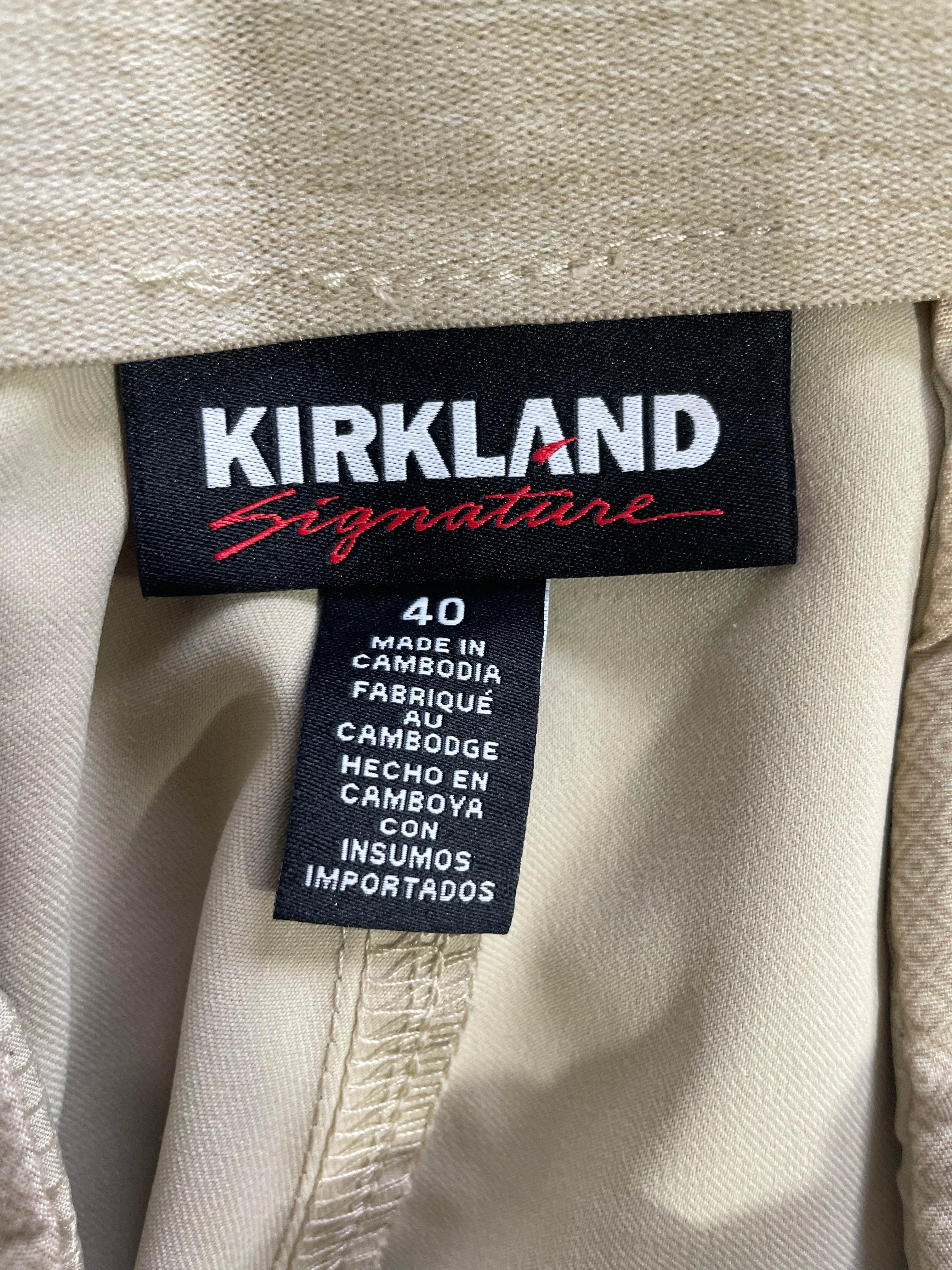 Kirkland Signature size 40 beige performance shorts item 7771457 hang tag