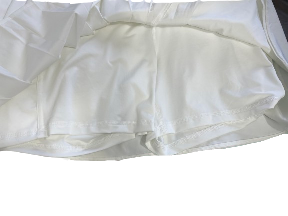 A pair of white cotton shorts with a relaxed fit and visible seam details, laid flat against a white background.