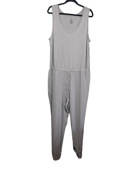 A light gray sleeveless footed jumpsuit hanging on a black hanger against a plain white background.