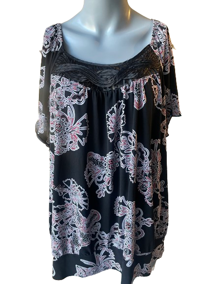 Short sleeve black floral top displayed on a mannequin
