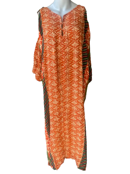 An orange, red, and black striped kaftan with a V-neckline and side slits, displayed on a mannequin.
