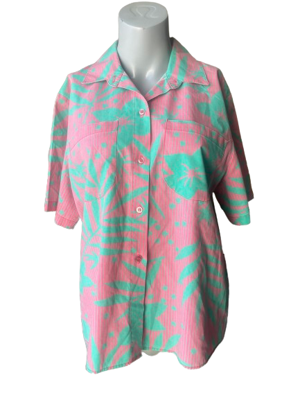 Koret Francisca Vintage Two-Piece Tropical Set, featuring a skirt with elastic waist and front pockets, and a shirt with button front, displayed on a mannequin.