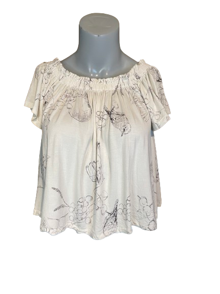 A beige short-sleeve top with a floral print, displayed on a mannequin.