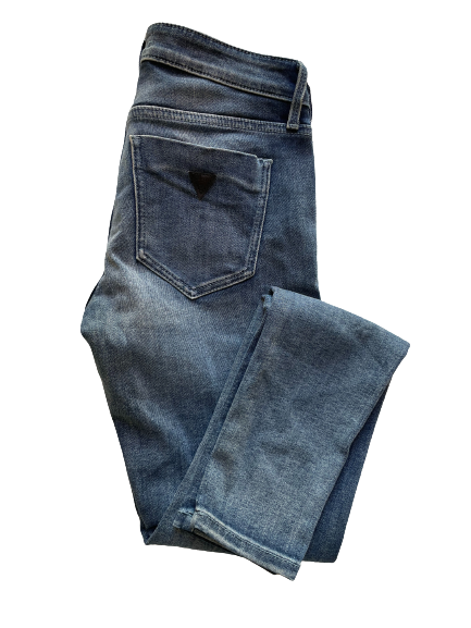 A pair of blue GUESS skinny leg jeans with five pockets, zipper fly, and button closure.