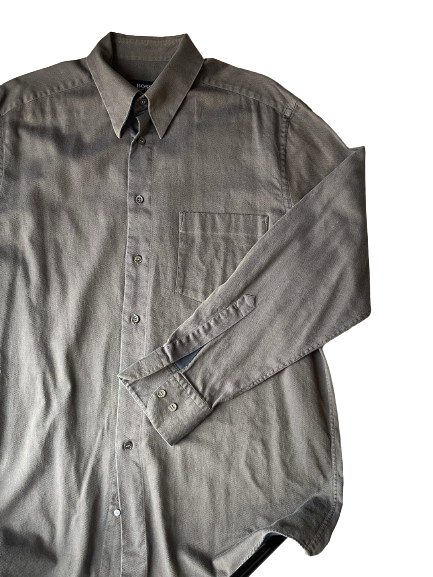 A grey Hugo Boss long-sleeved shirt with a collar, button-up front, and a chest pocket.