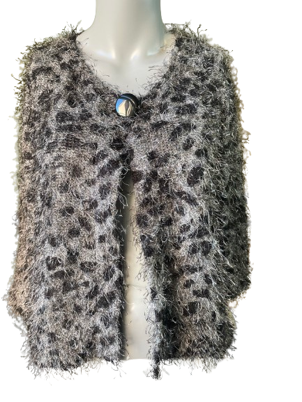 A gray and black fuzzy cardigan with leopard print on the sleeves, displayed on a mannequin.