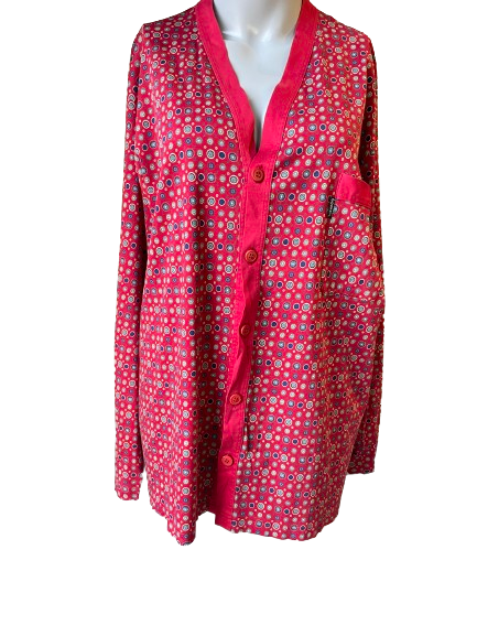 A burgundy two-piece pyjamas set with a front button closure top and elastic waist pants, displayed on a mannequin.