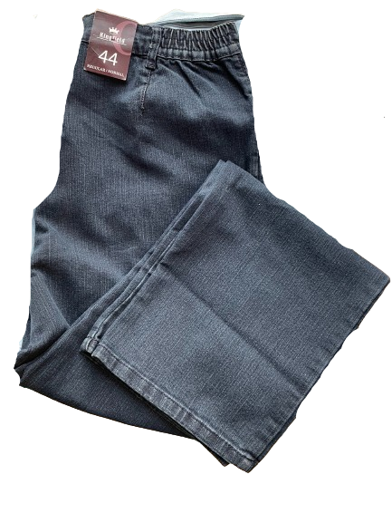 A pair of Kingfield Charles Voegele Laura Jeans with a zipper fly, button closure, and front zipper pockets. The jeans are displayed on a dark background.