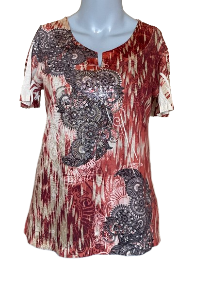 A short sleeve top with a boho design featuring orange, red, and white colors, adorned with paisley patterns, rhinestones, and studs.