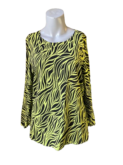 A mannequin displaying a green and black zebra print blouse.