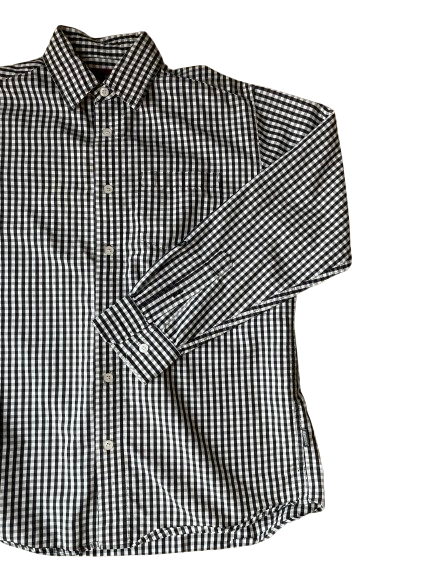 A black and white checkered shirt with long sleeves, collar, and button-up front.
