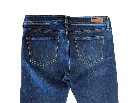 A pair of UJ UNIQLO Skinny Fit Straight Middle Rise Jeans in blue color, back view
