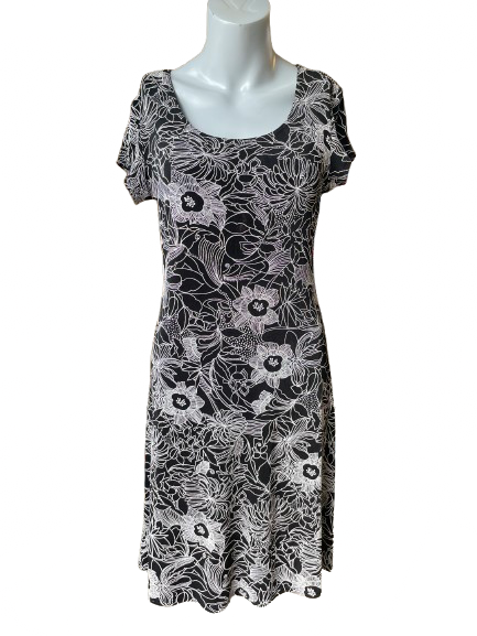 Tiana B Black Floral Etched Stretchy Dress displayed on a mannequin against a blurred background with black etched patterns.