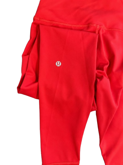 Lululemon orange leggings size 8 with logo detail