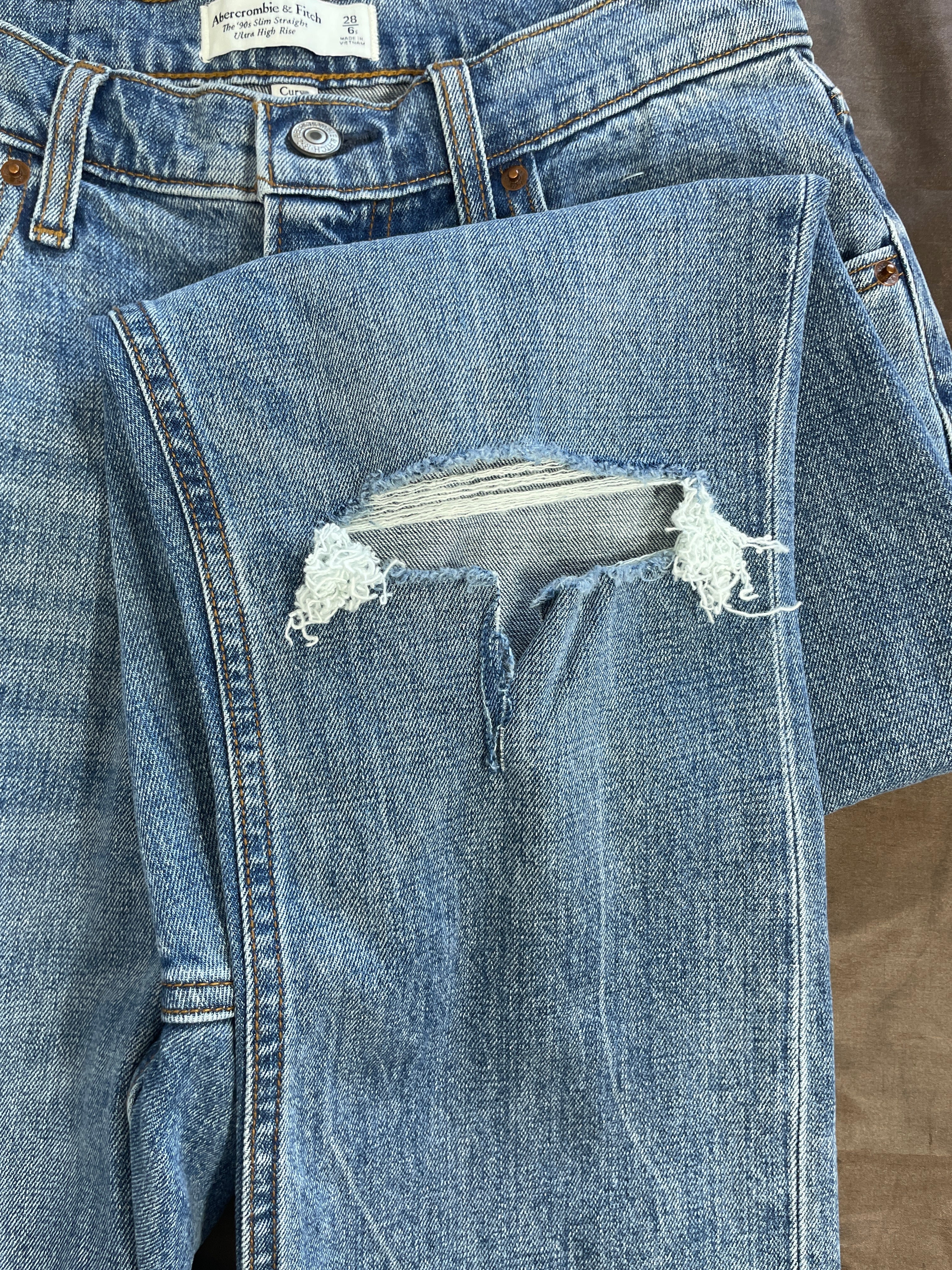 Abercrombie 90s slim straight blue jeans distressed knee detail