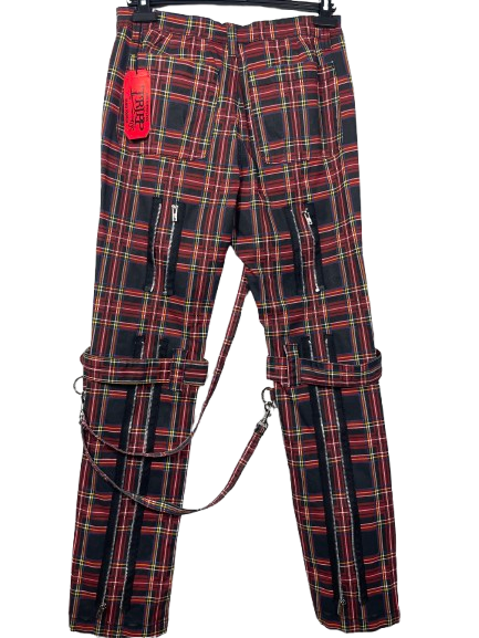 Red and black plaid cargo pants with multiple zippered pockets and a matching strap detail, shown hanging against a white background.