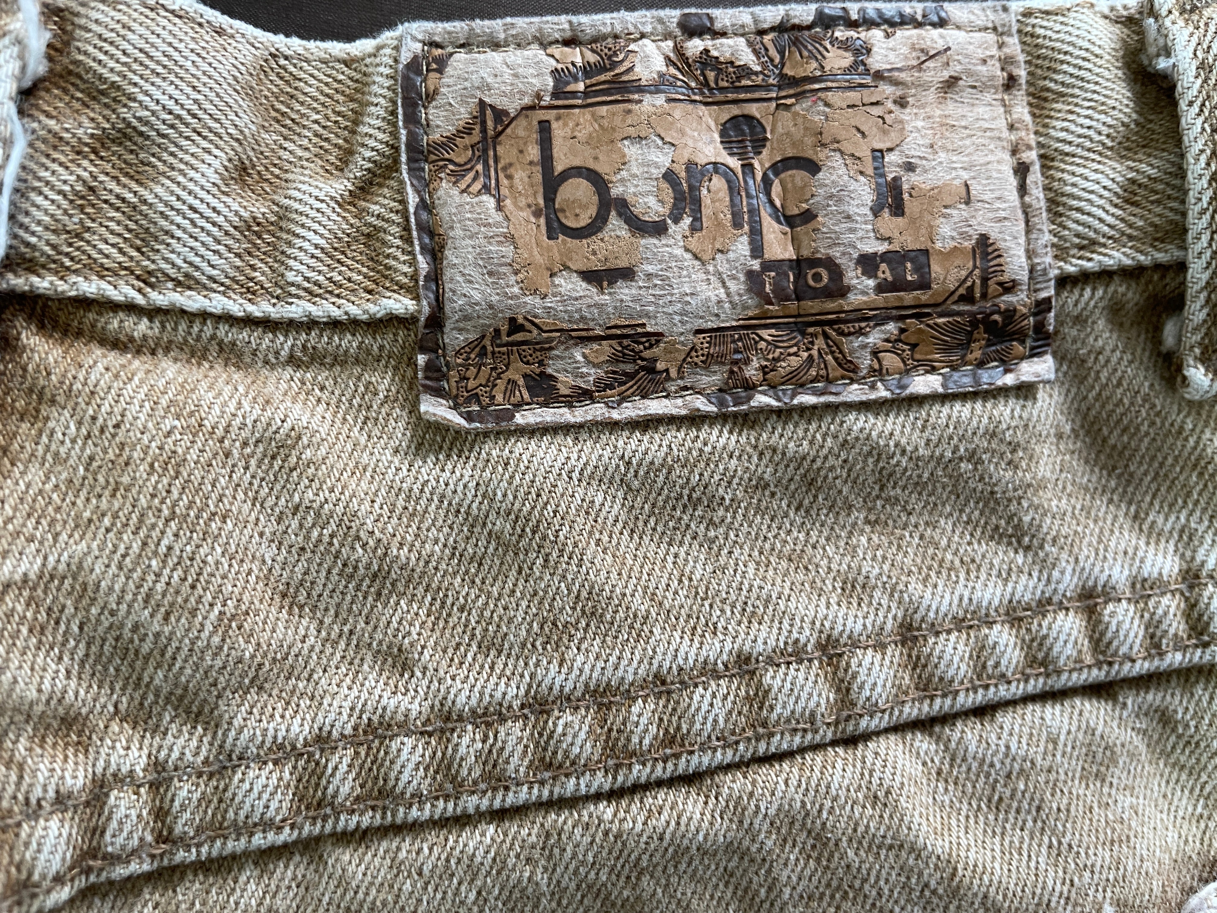 Bonjour International vintage jeans distressed logo patch detail