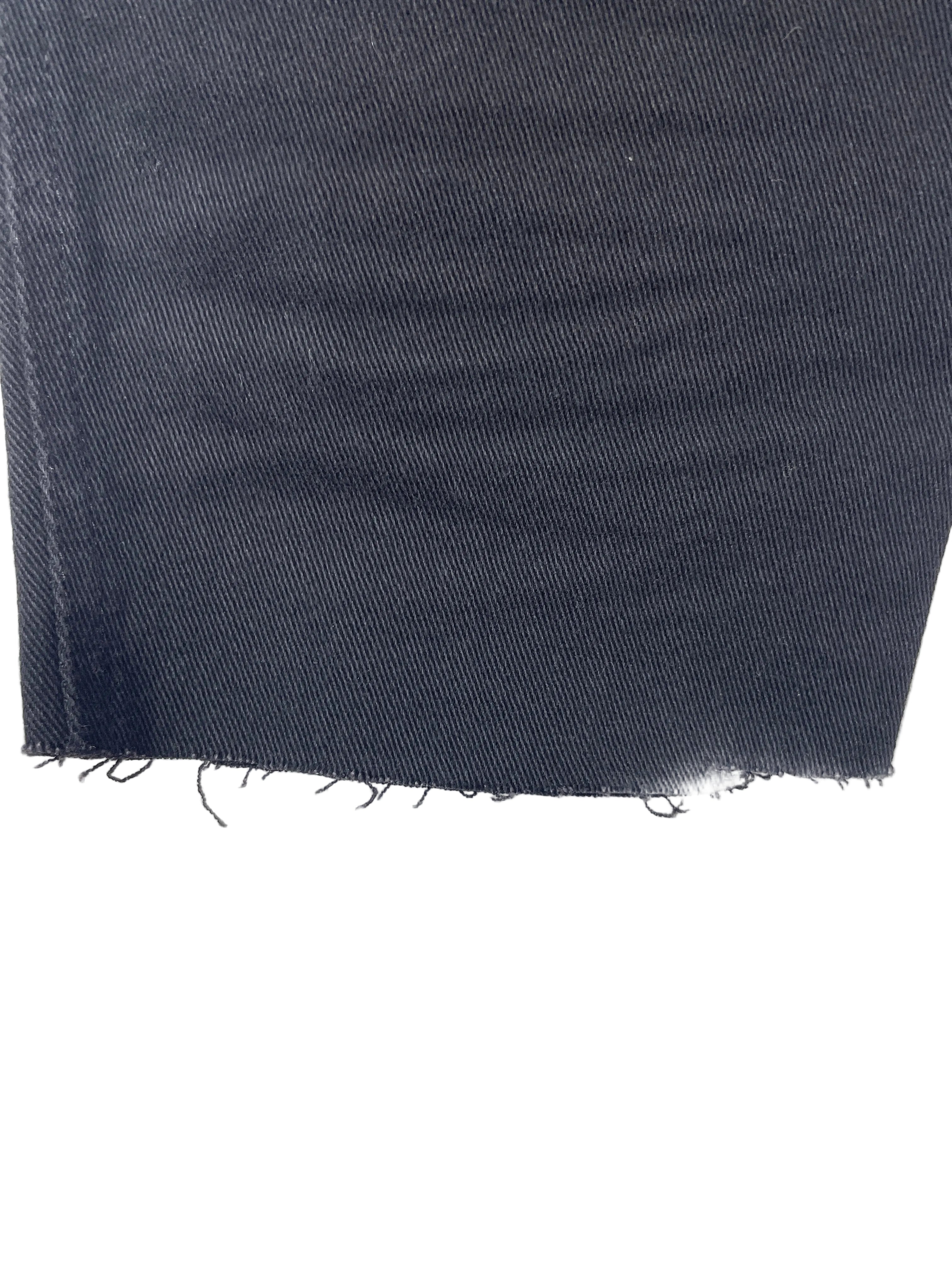  Tripp NYC black cotton twill capri pants close-up of unfinished raw-cut hem