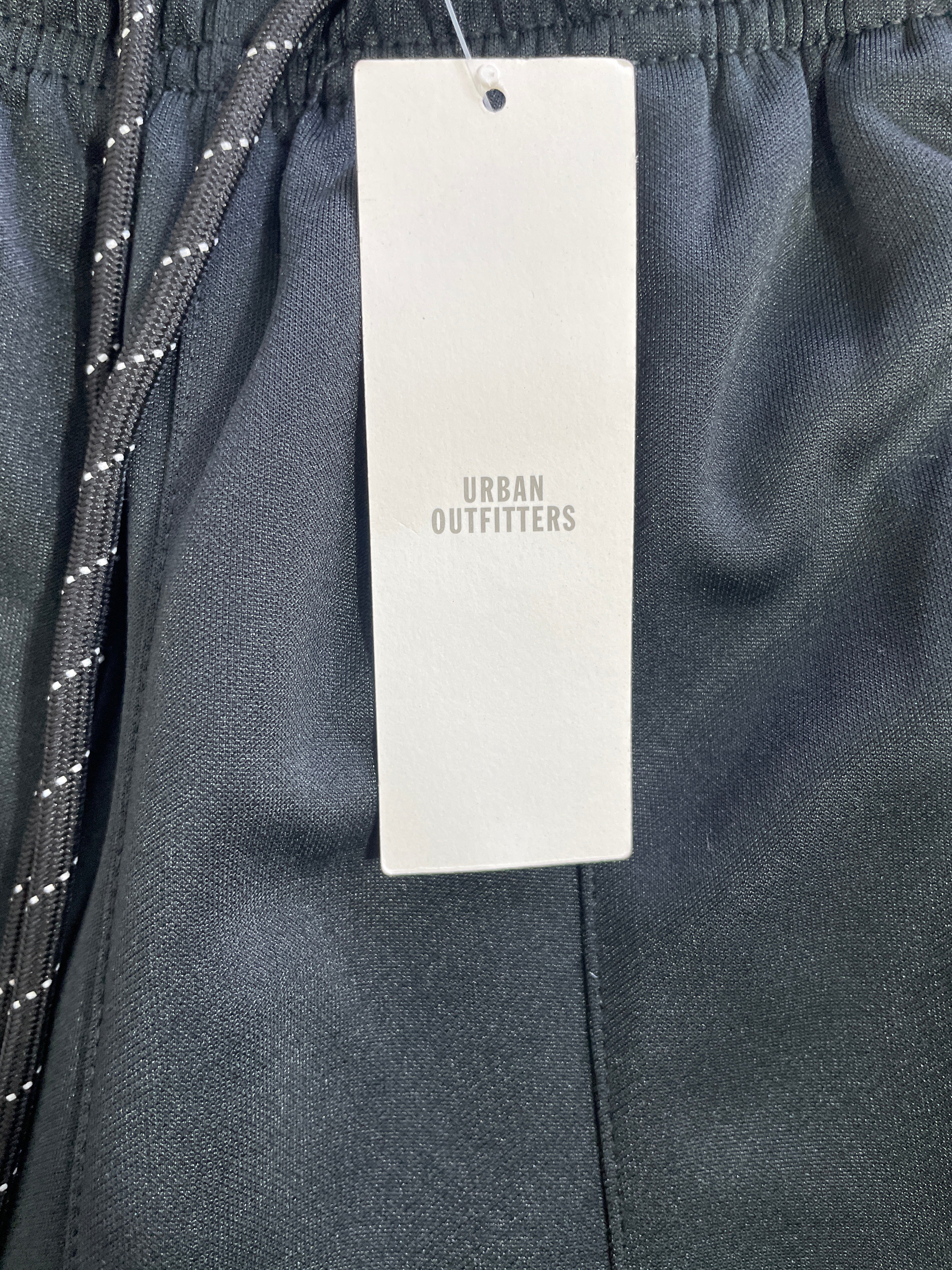 Urban Outfitters original clothing hangtag on black polyester track pants size Small