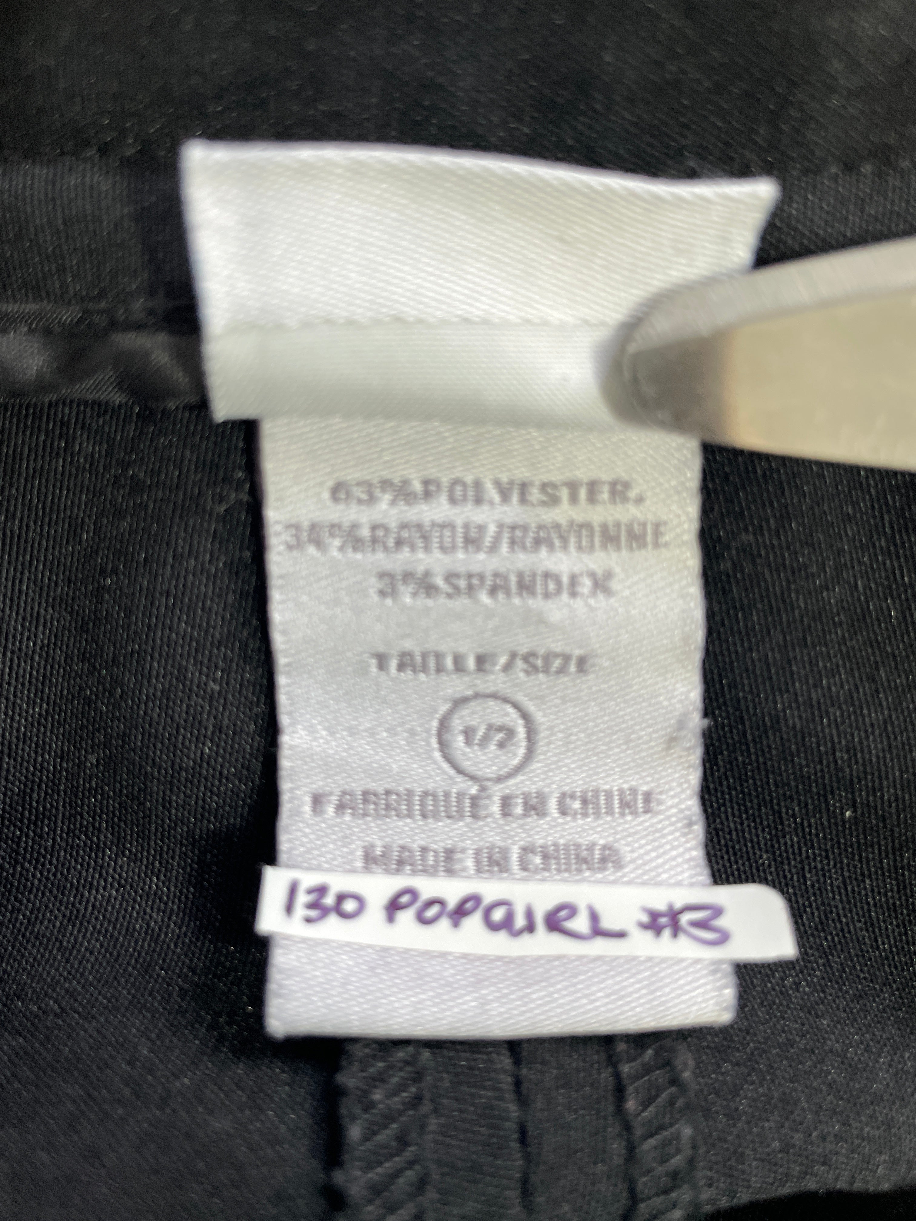 SUZY Shier black cropped pants fabric label showing polyester rayon spandex blend