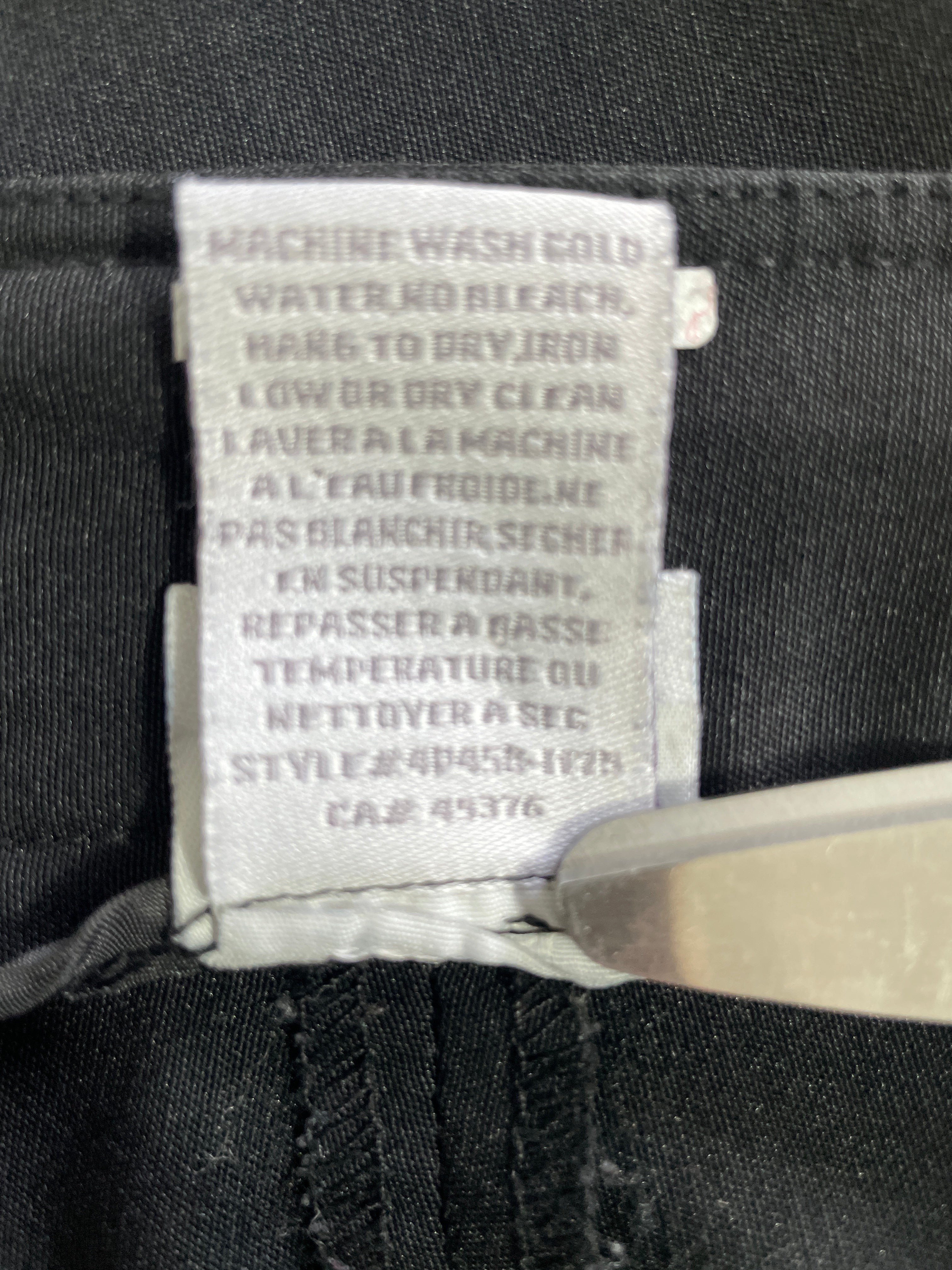 1. SUZY Shier black cropped pants interior care label and style information