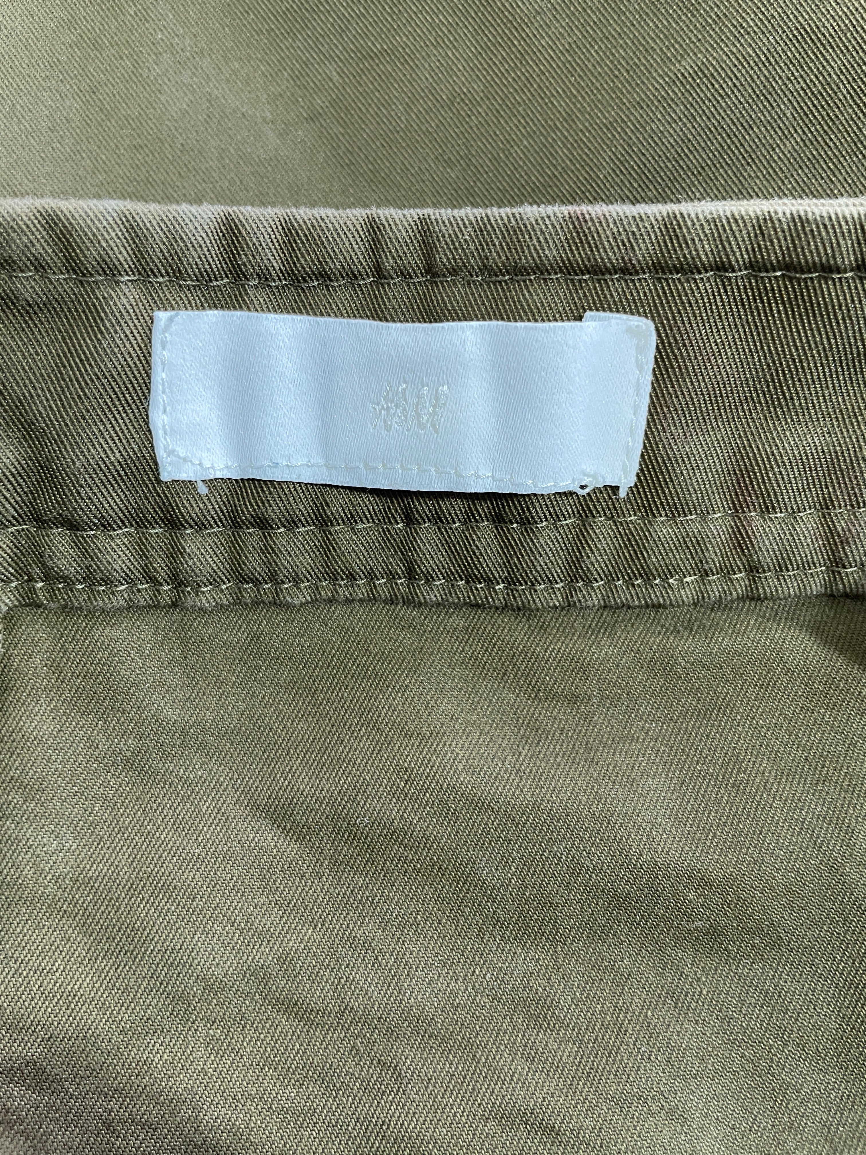 H&M olive green mini skirt interior brand label detail