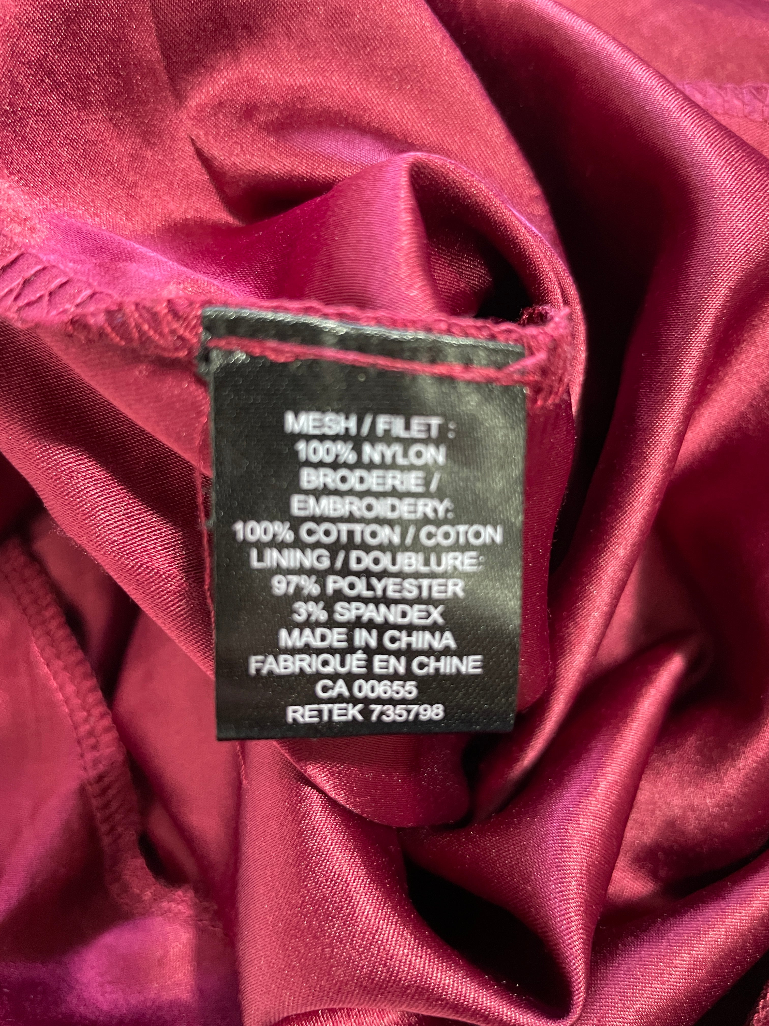 RW&CO. burgundy lace skirt fabric composition label showing cotton embroidery and stretch lining