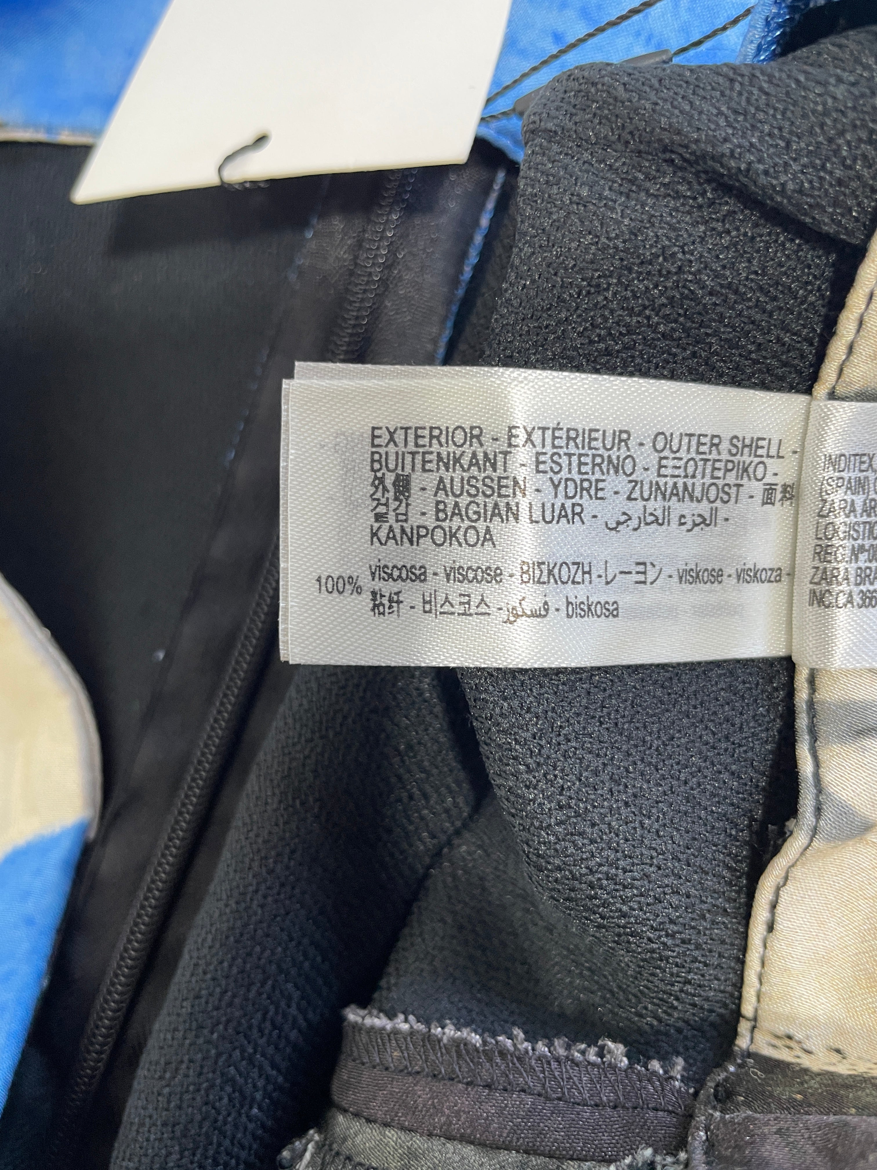 Zara skirt fabric composition label showing 100 percent viscose outer shell