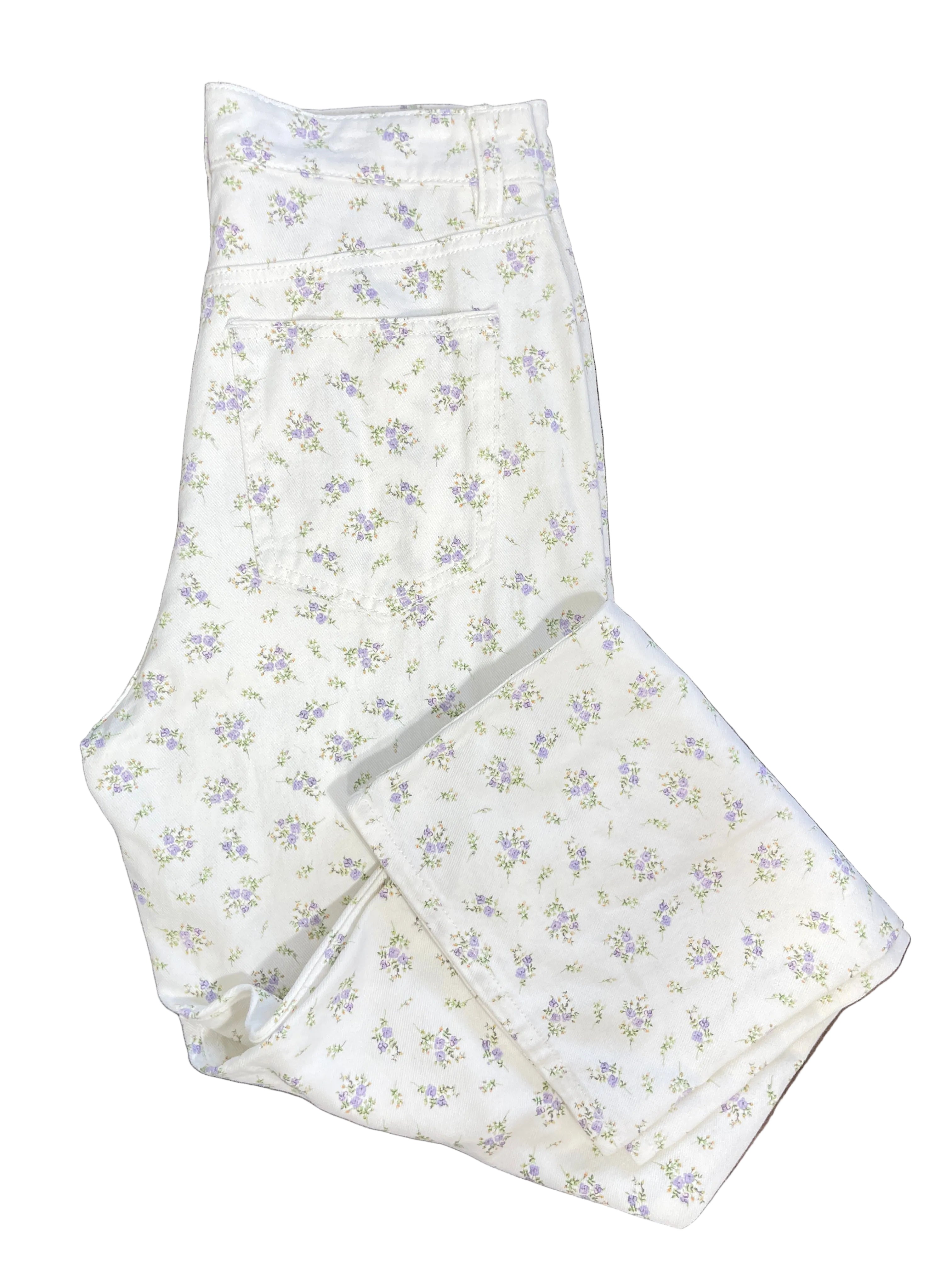 H&M white denim jeans with tiny lavender purple floral bouquets folded to show back pocket and leg
