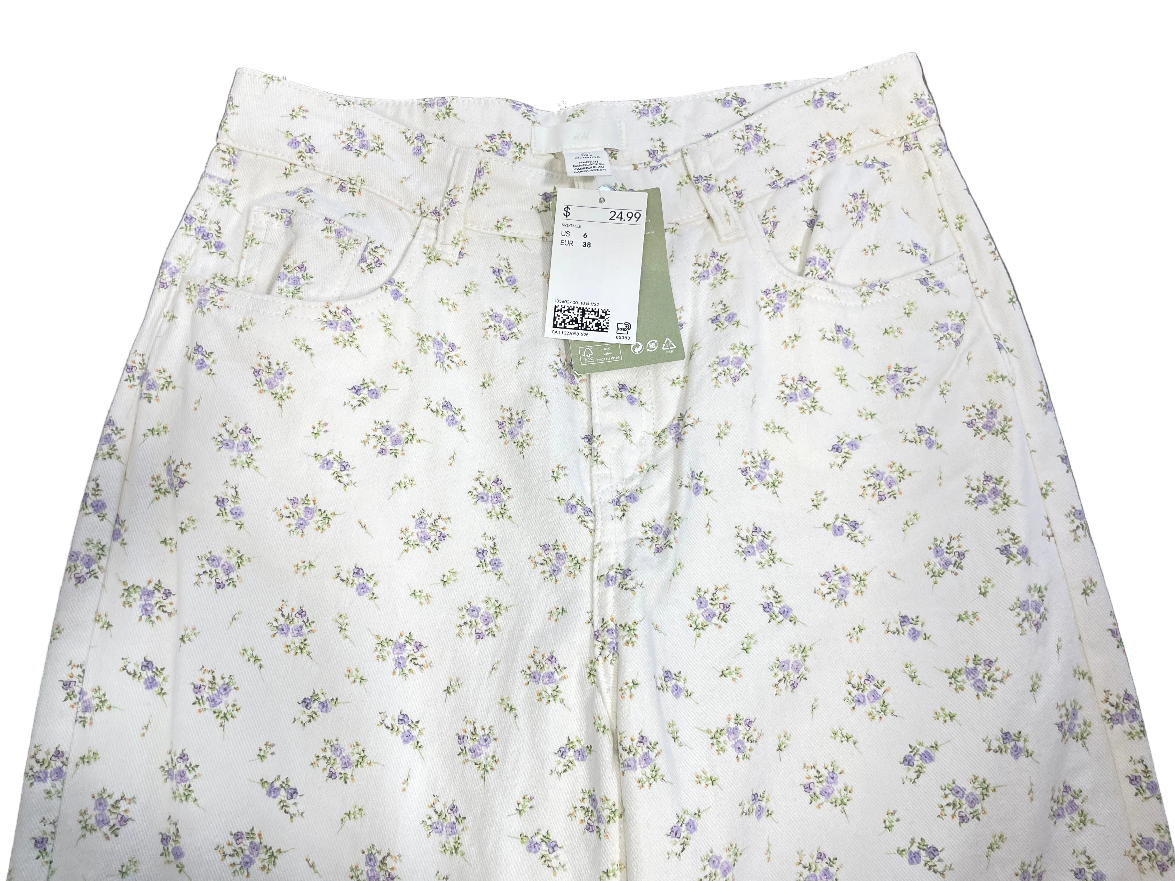 Front view of H&M white lavender ditsy floral jeans with five-pocket design and original price tag