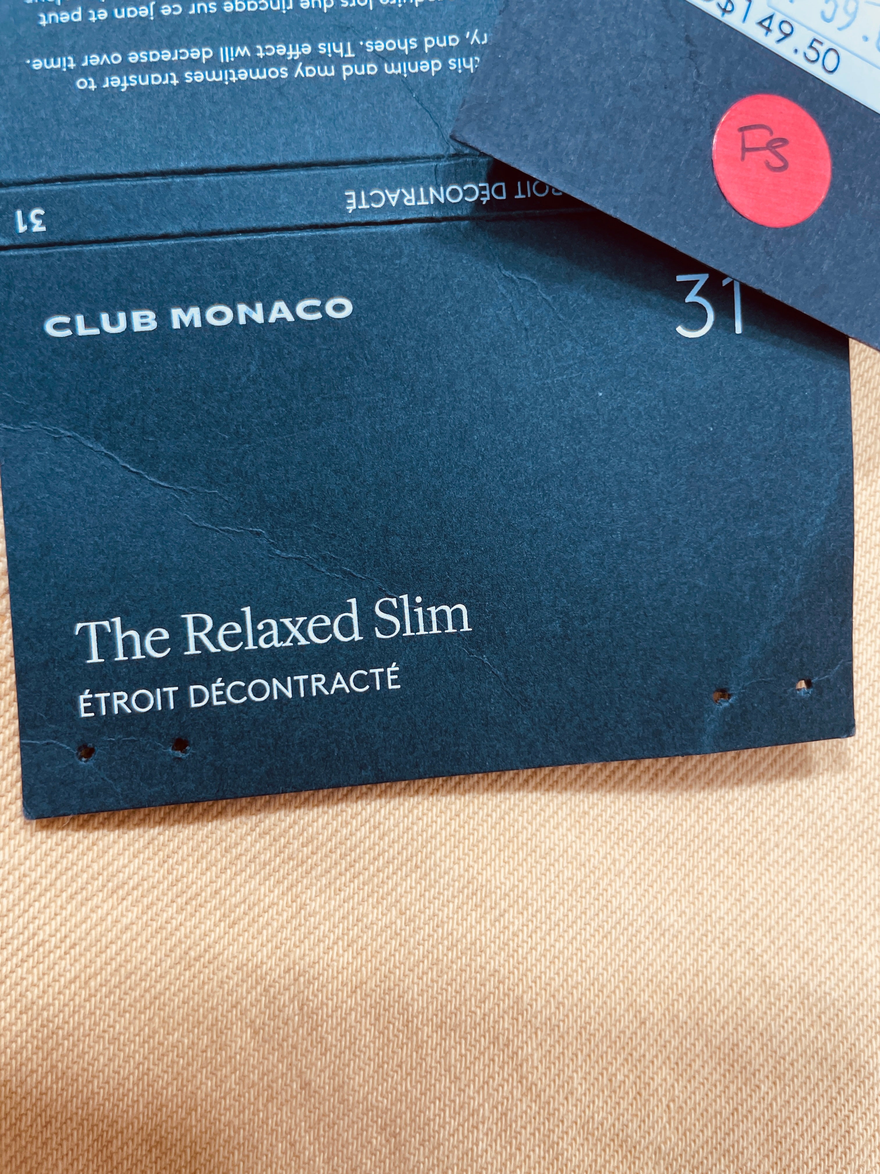 Club Monaco The Relaxed Slim jeans black brand hangtag with fit description