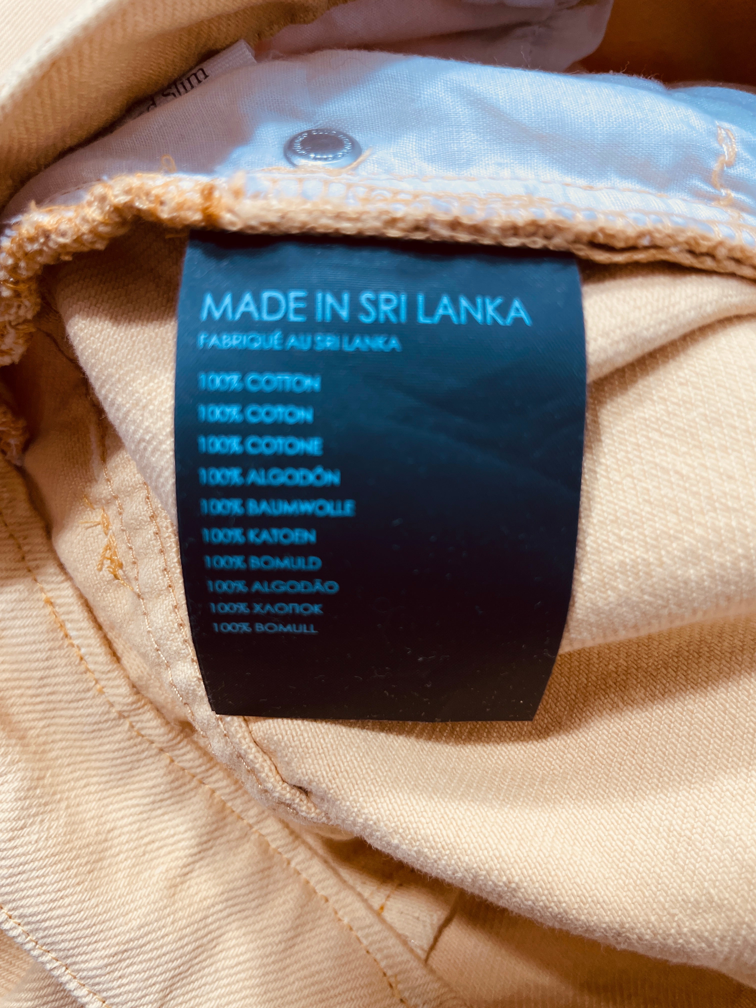 Club Monaco jeans 100 percent cotton fabric care label made in Sri Lanka