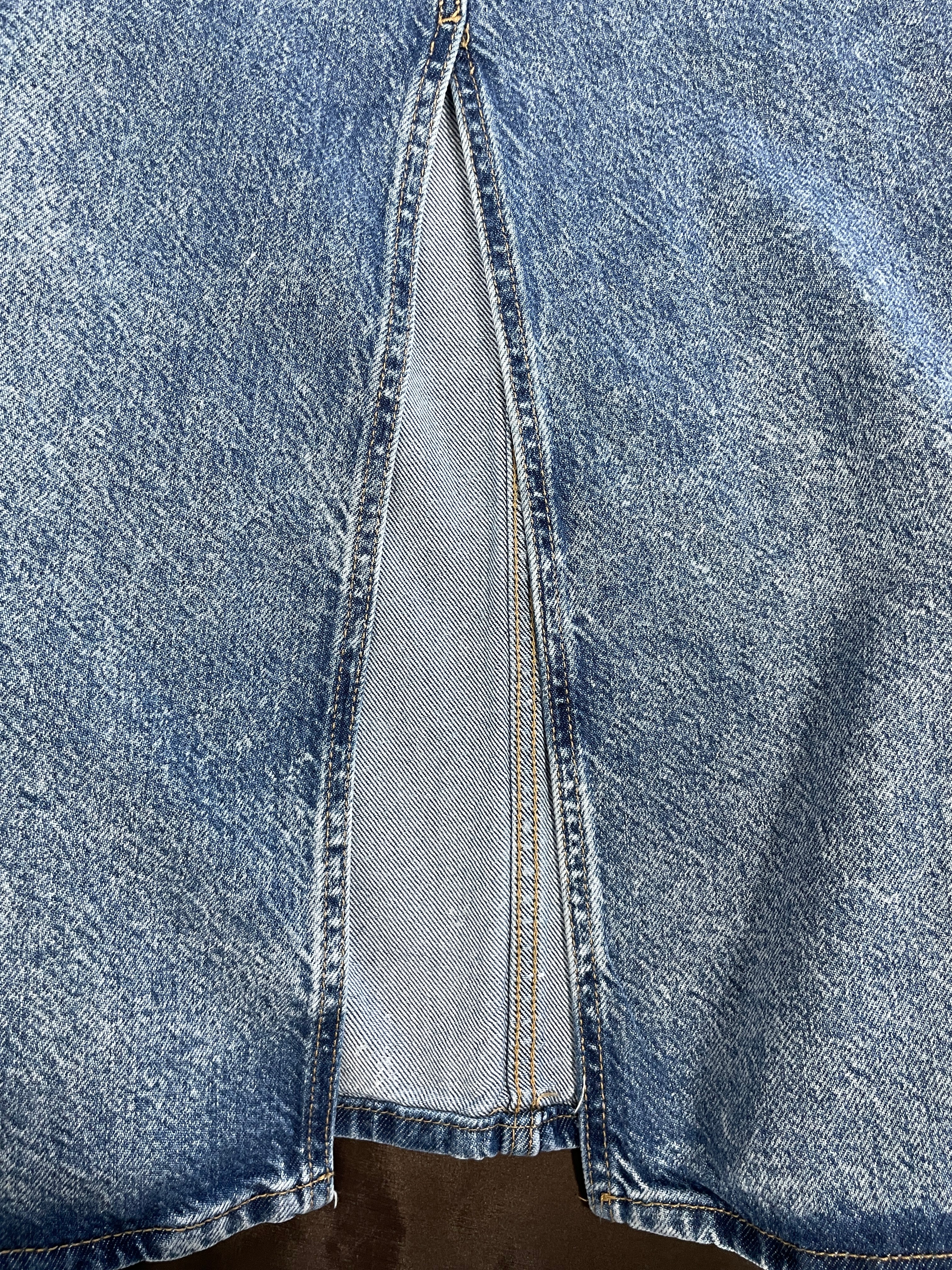 Close-up of H&M denim maxi skirt long back slit and contrast stitching