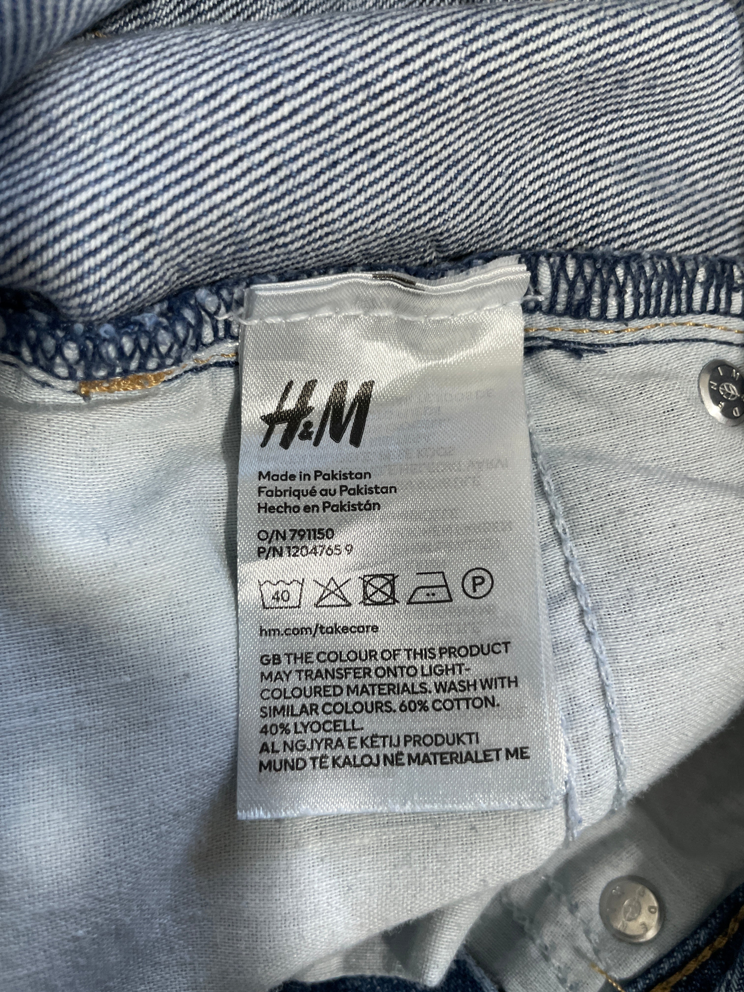 H&M denim skirt fabric care label showing 60 percent cotton and 40 percent lyocell