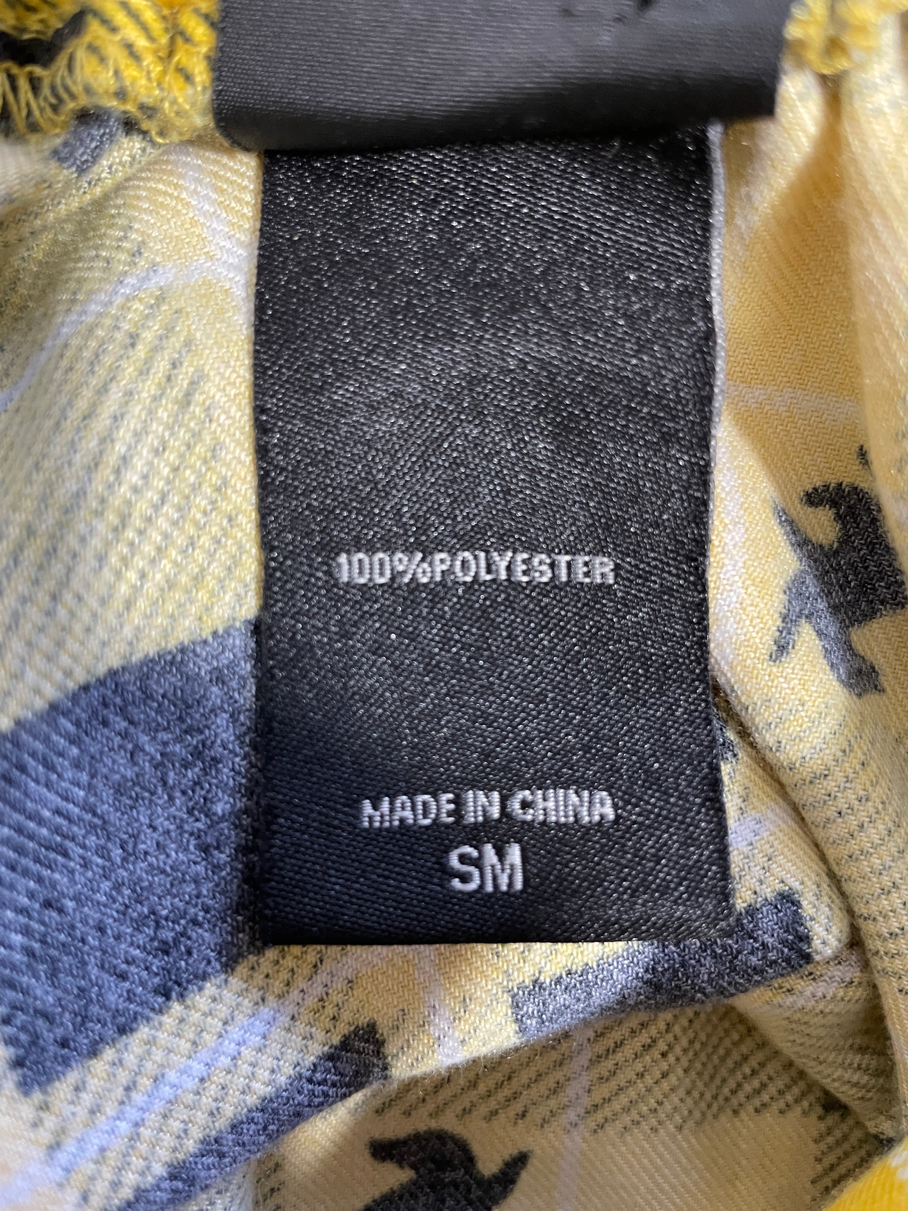 Harry Potter Hufflepuff yellow plaid skirt fabric and care information tag