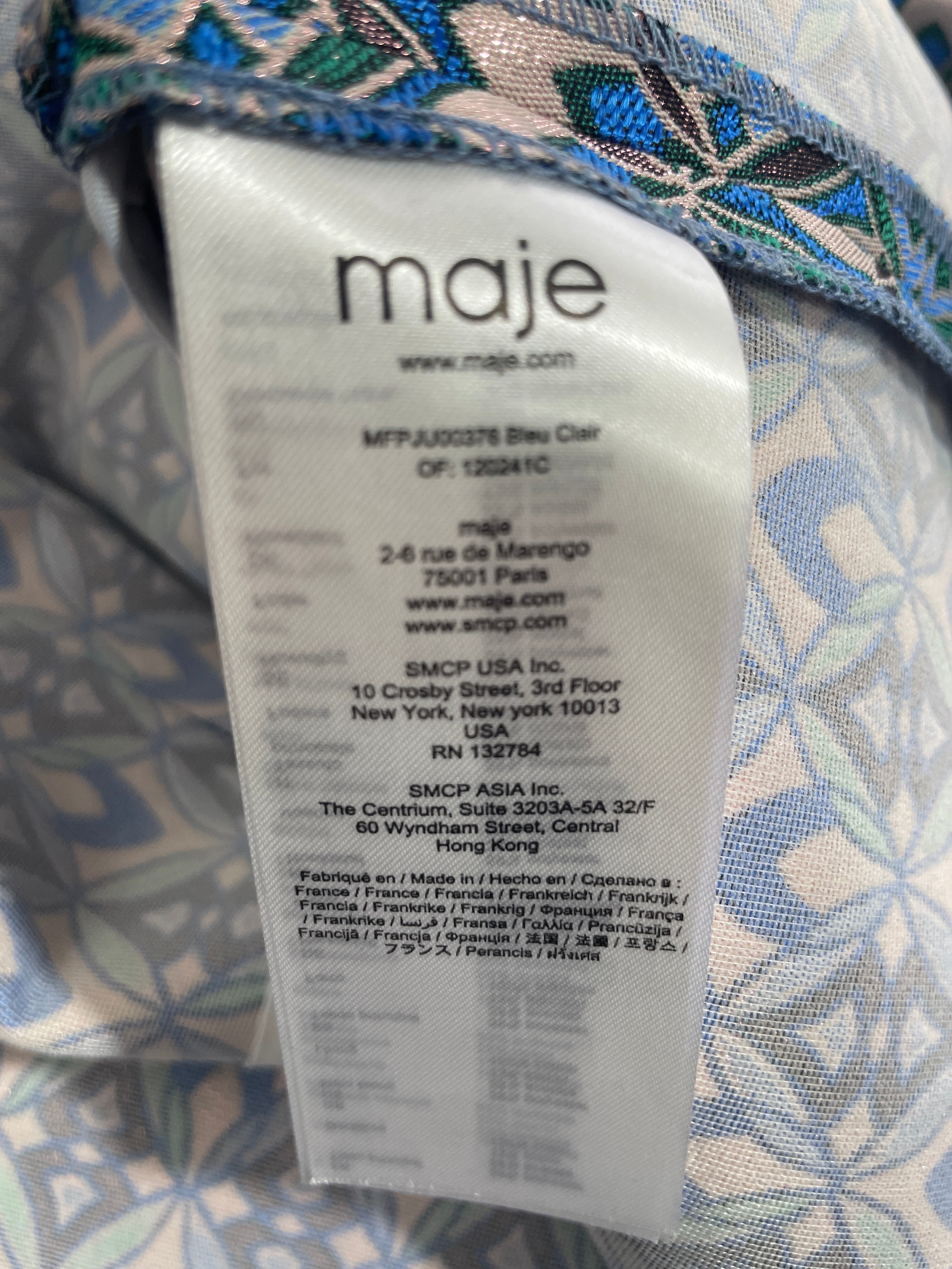 Maje designer garment identification label inside patterned mini skirt