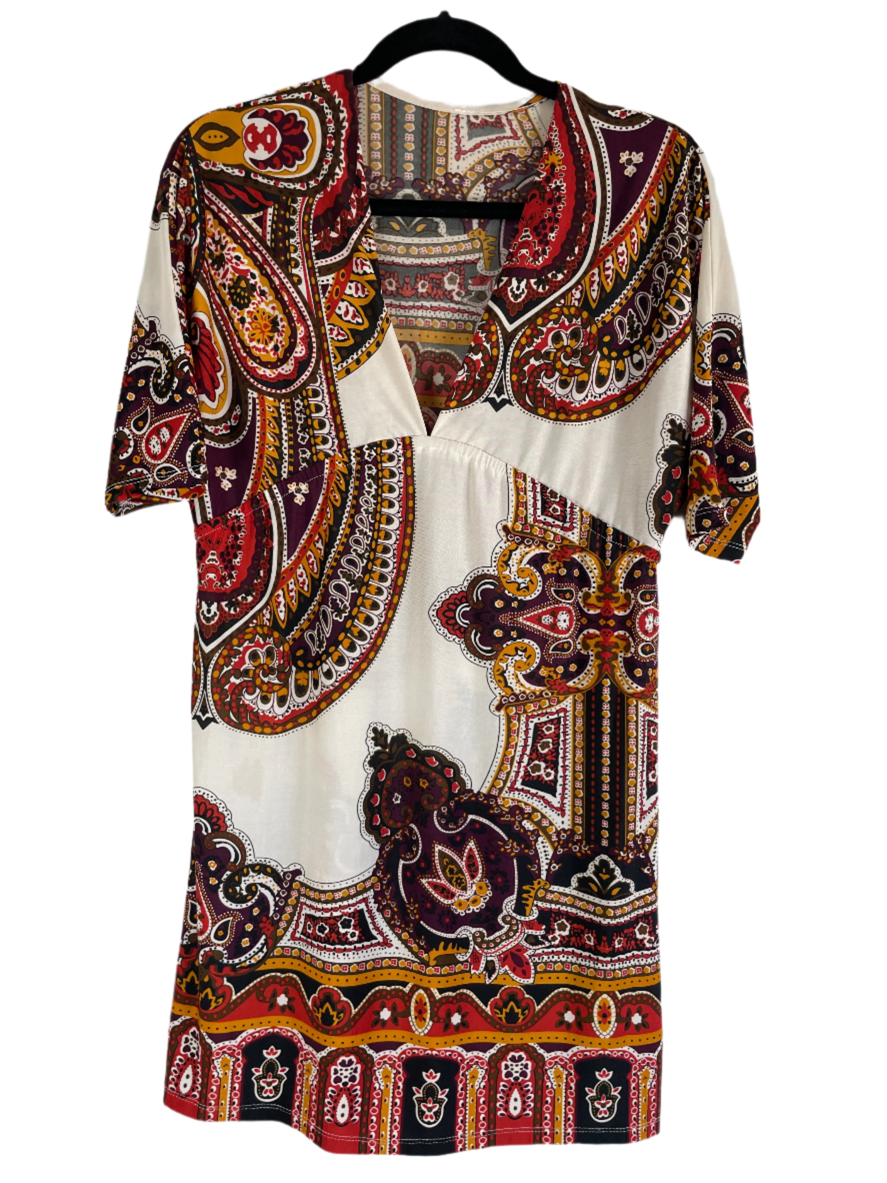 Paisley patterned dress on a white background