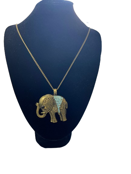 Gold elephant pendant necklace on a black mannequin bust