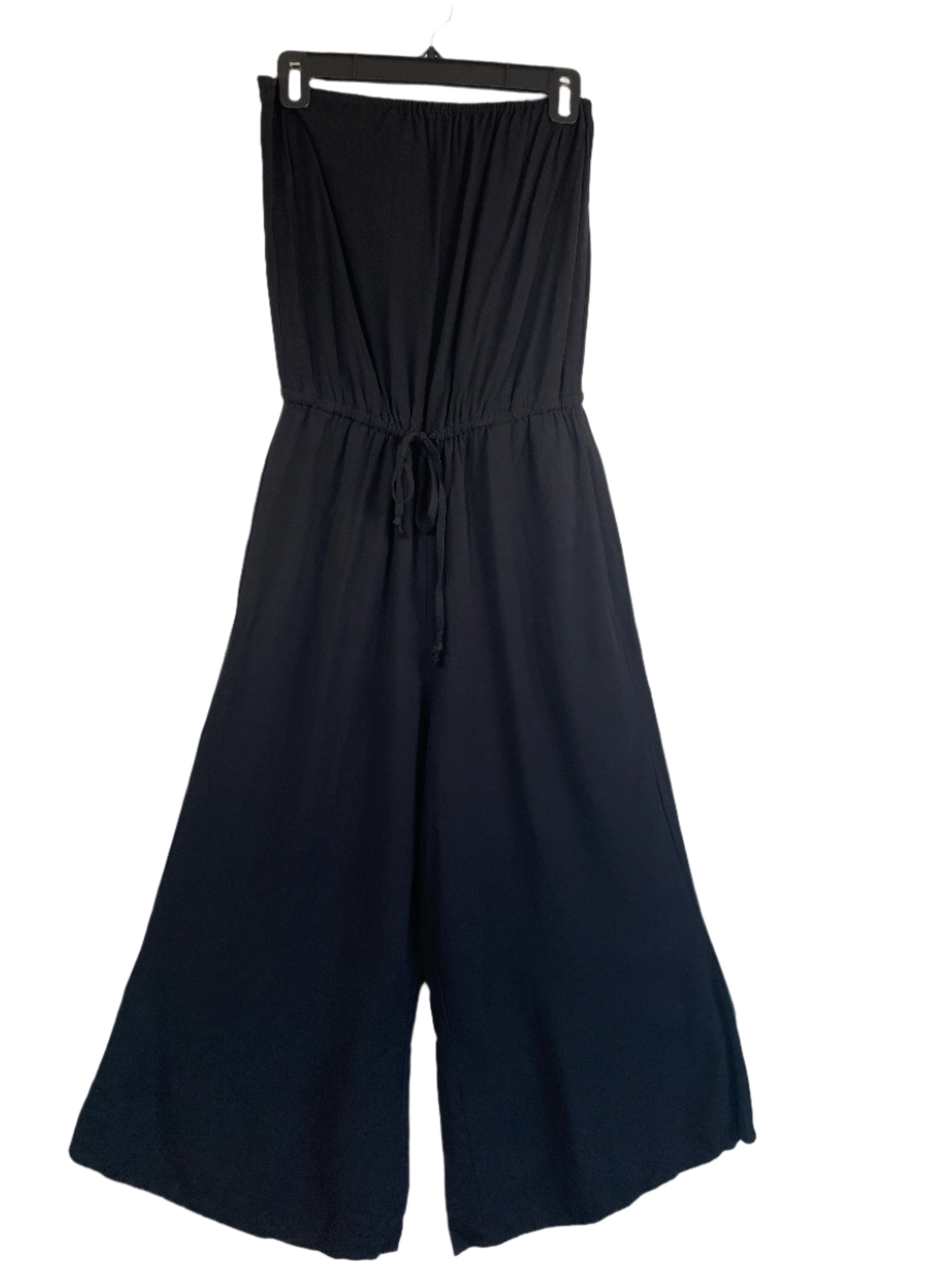 Black strapless wide-leg Venus jumpsuit with drawstring waist and pockets, size medium, hanging on black hanger