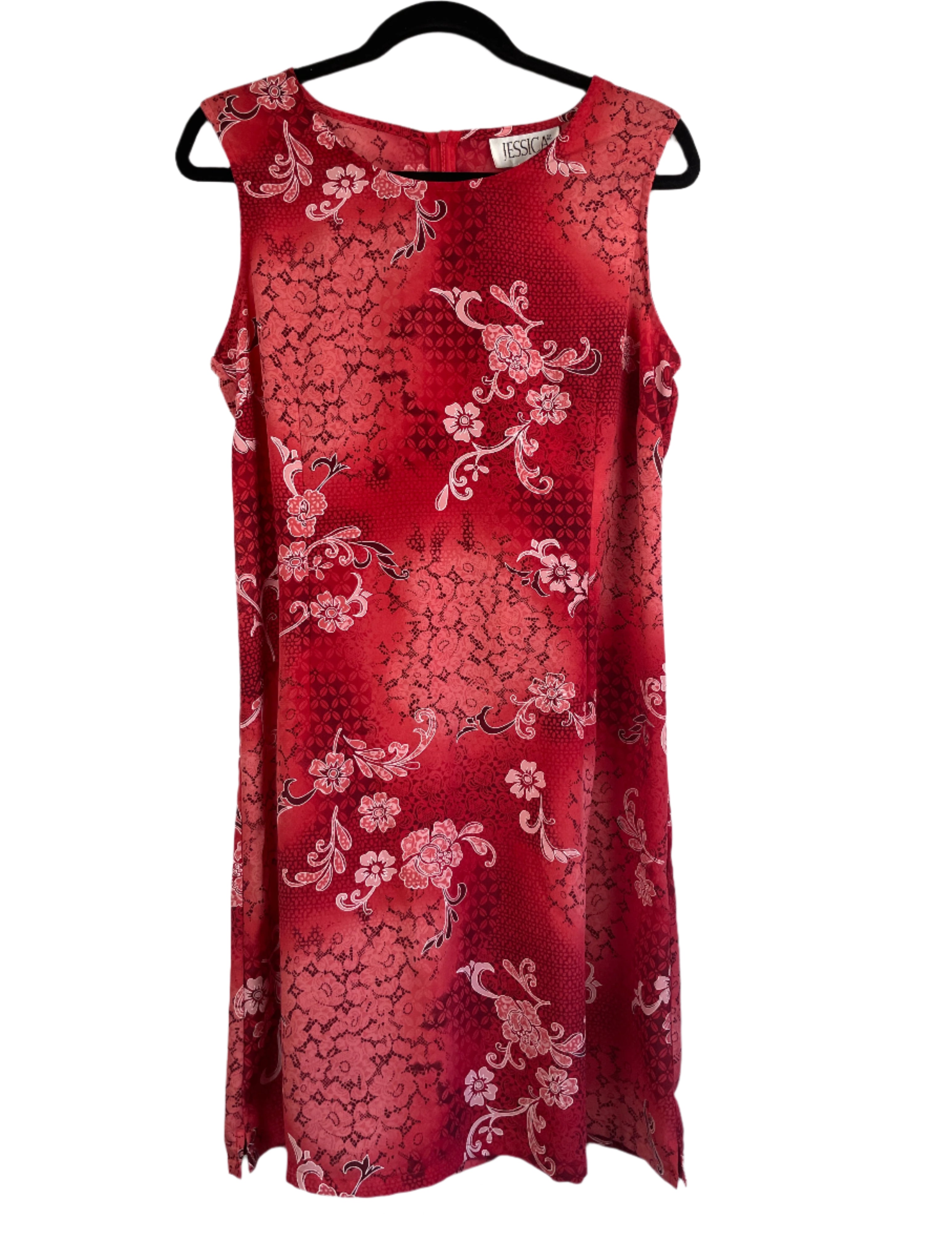 Front view of a sleeveless red Jessica dress with floral and geometric print, featuring a back tie and back zipper, size 16.