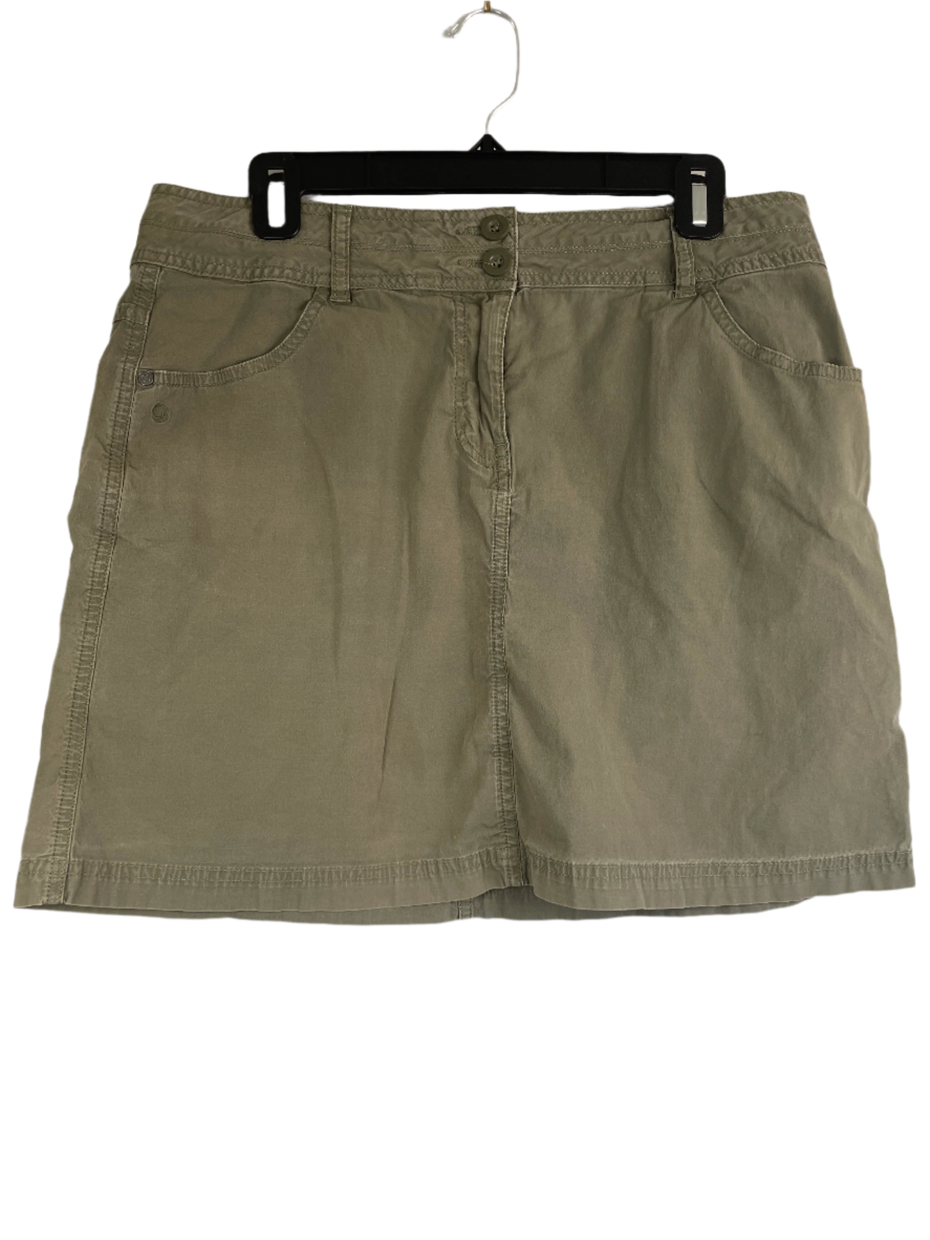 Front view of a Mountain Equipment Co-op army green cotton skirt with four pockets, size 10.