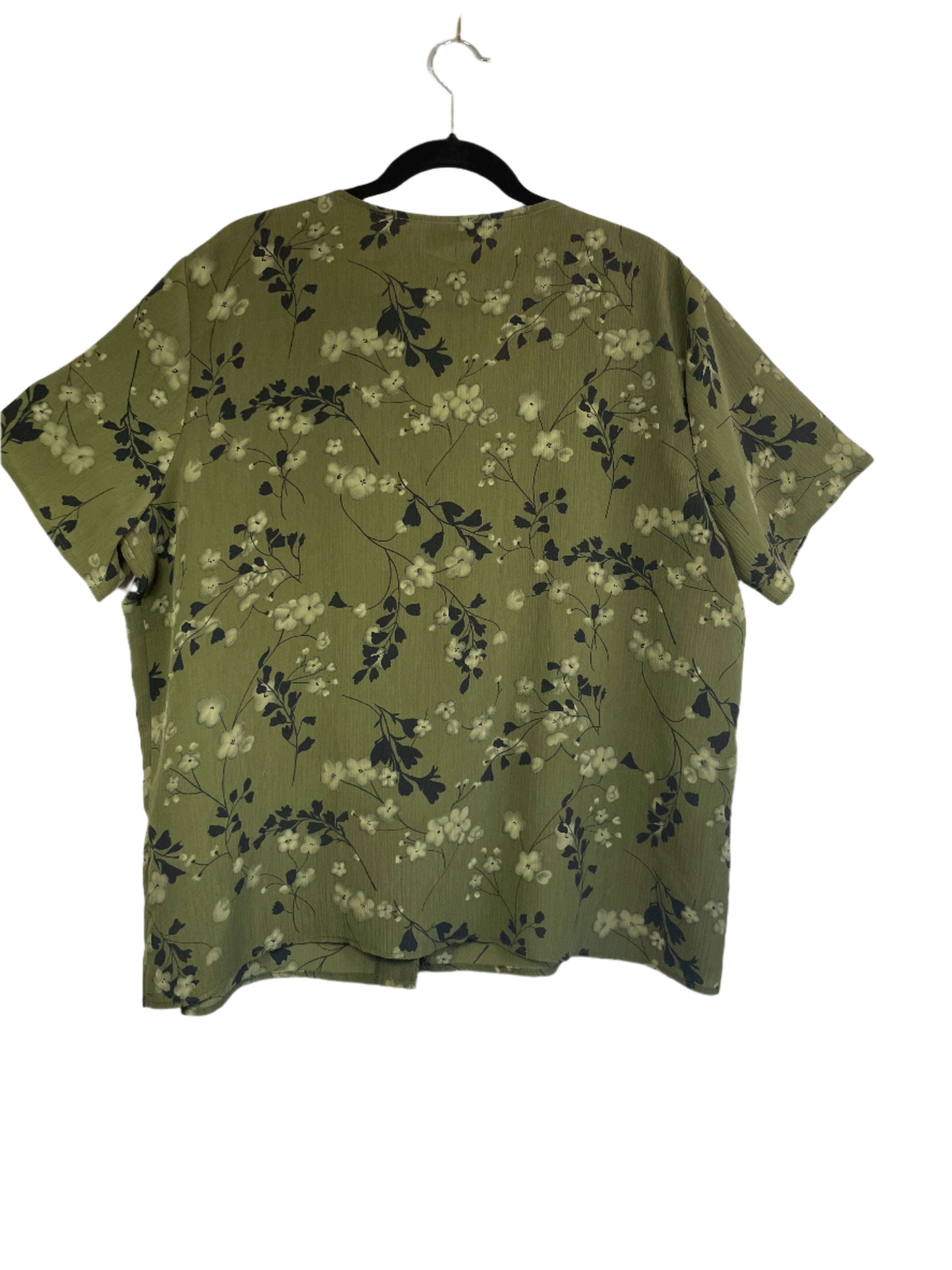 Green floral-patterned sleeveless top on a white background
