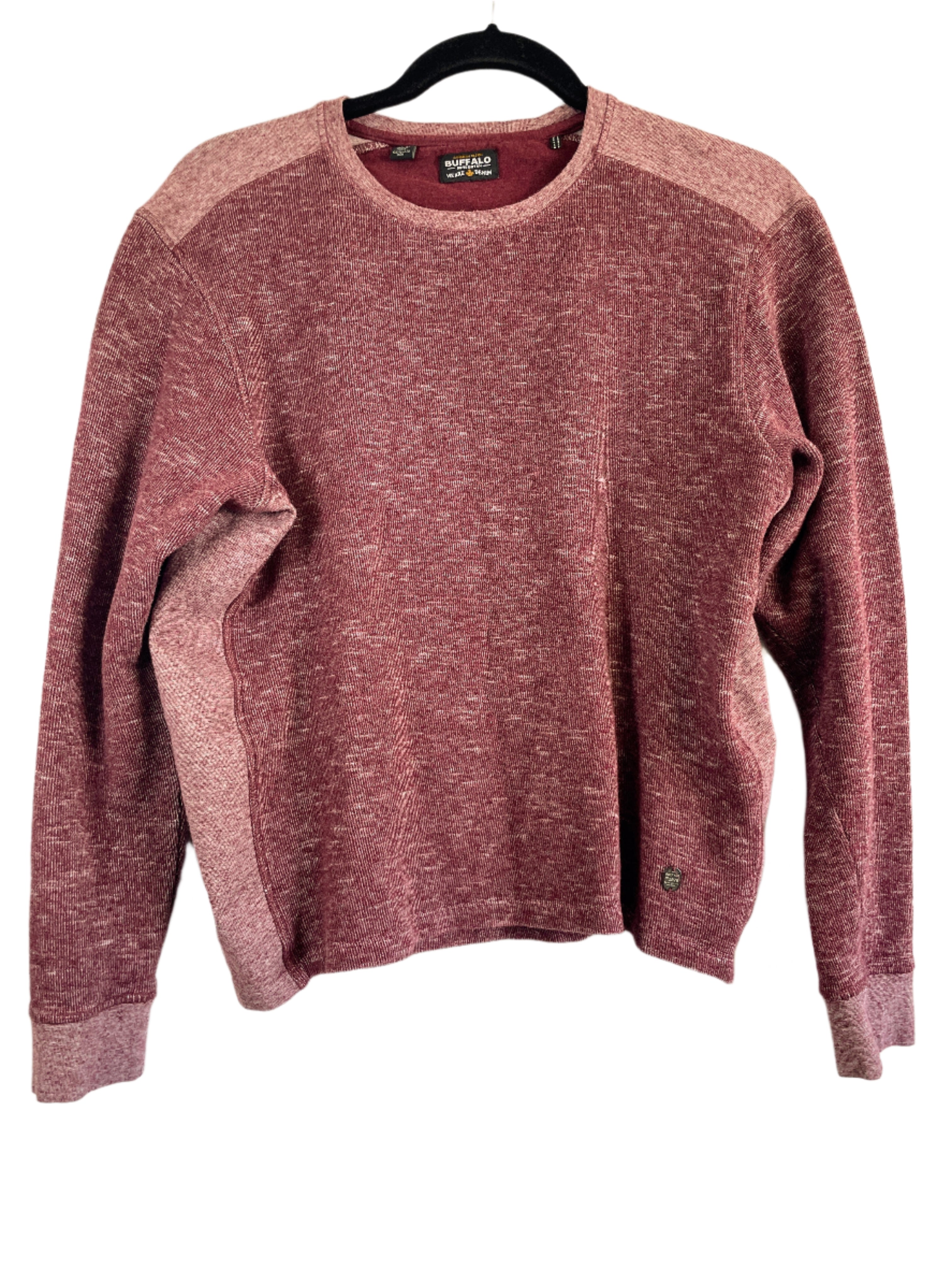 Front view of a red heathered Buffalo long sleeve sweatshirt in size medium, made of 100% cotton, displayed on a hanger.