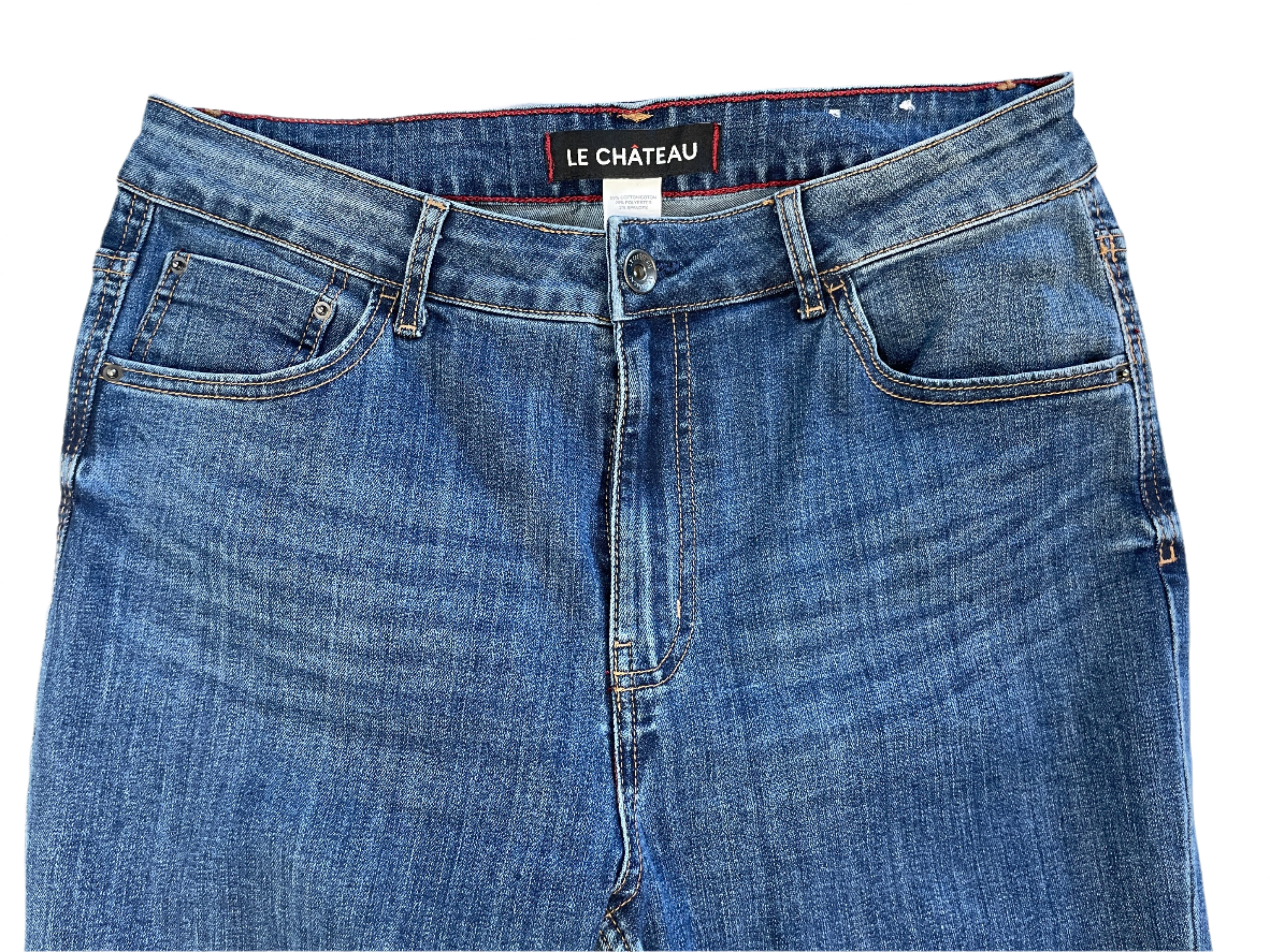 Blue jeans with 'Le Chateau' label on a white surface