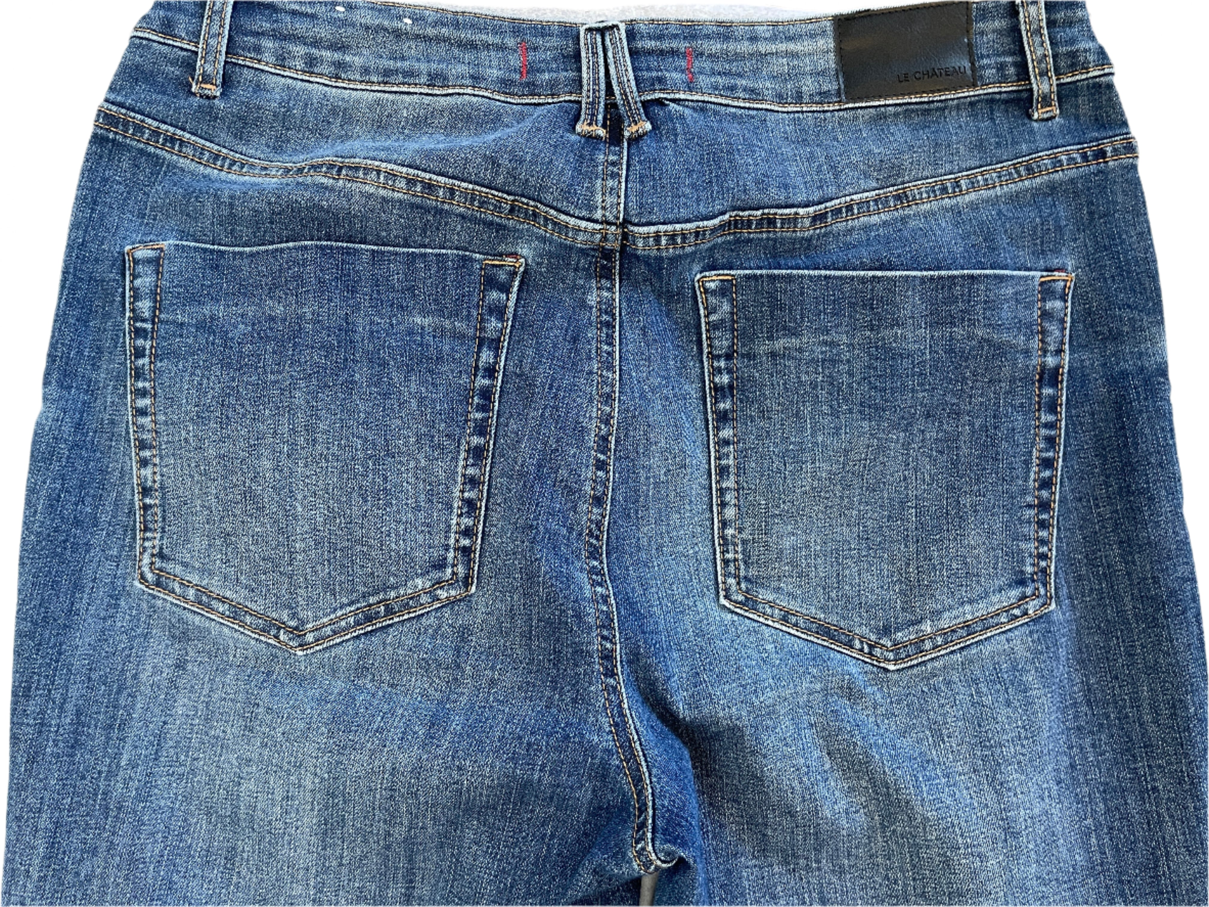 Blue jeans with a brand label on a white background