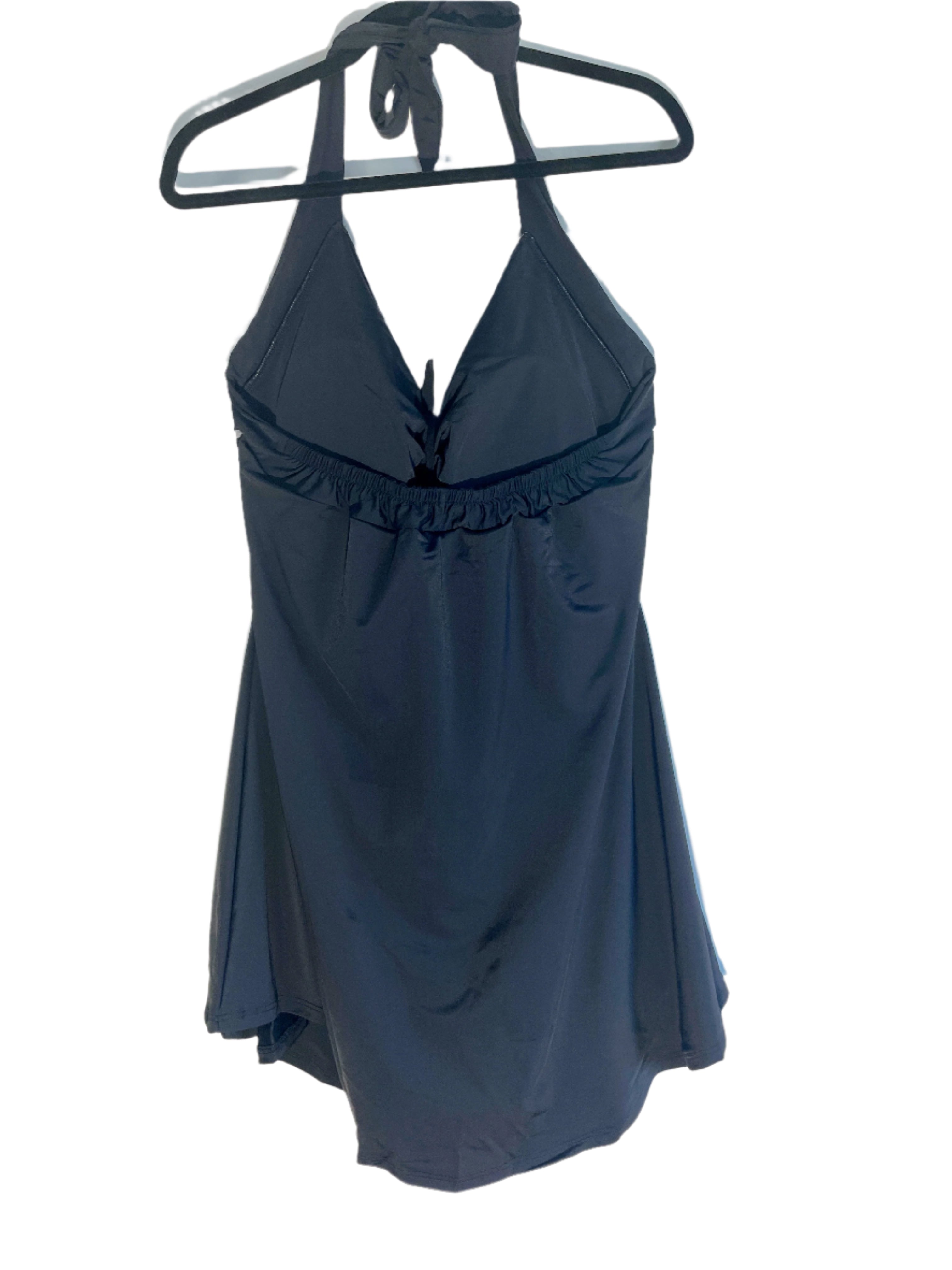 back view of a black and white halter-style one-piece swimsuit with gingham bust and skirt overlay, size 22