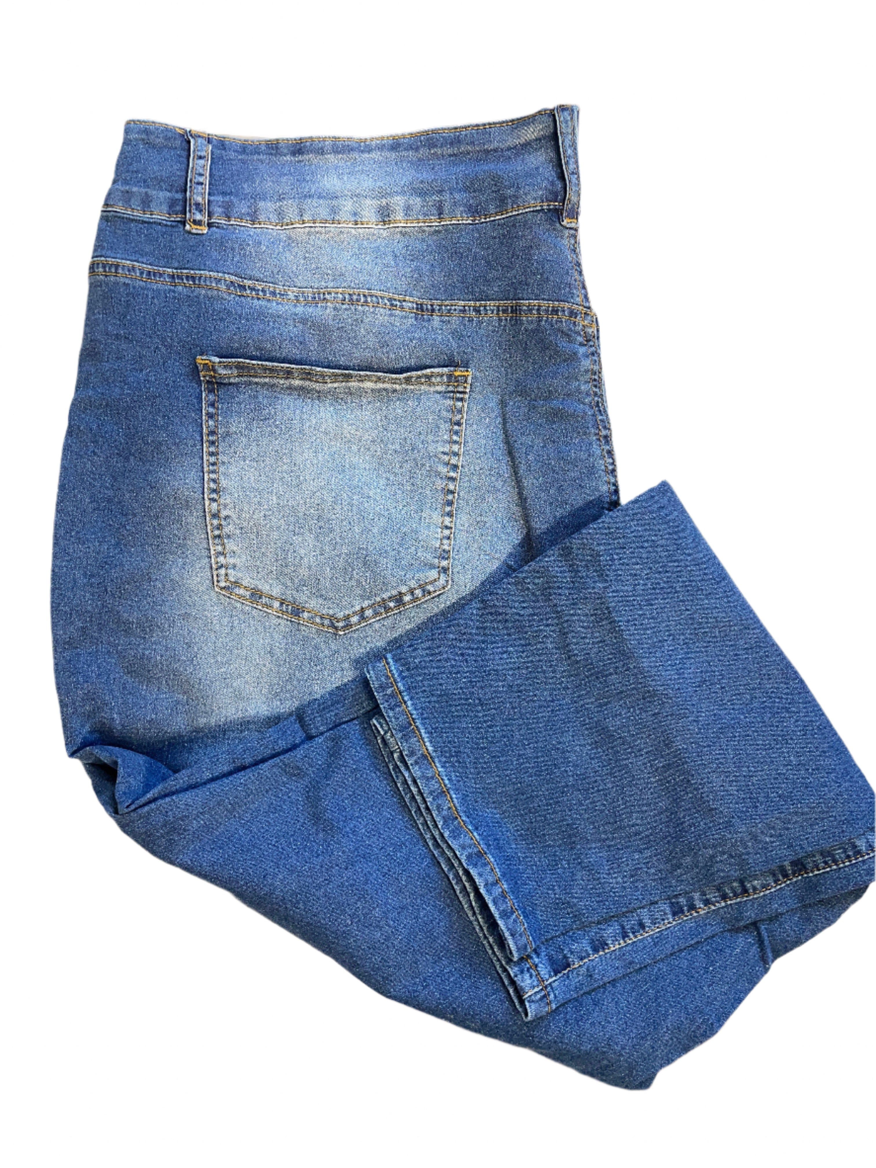 Back view of folded Gboomo plus size faded blue skinny jeans with rear pocket and belt loops.