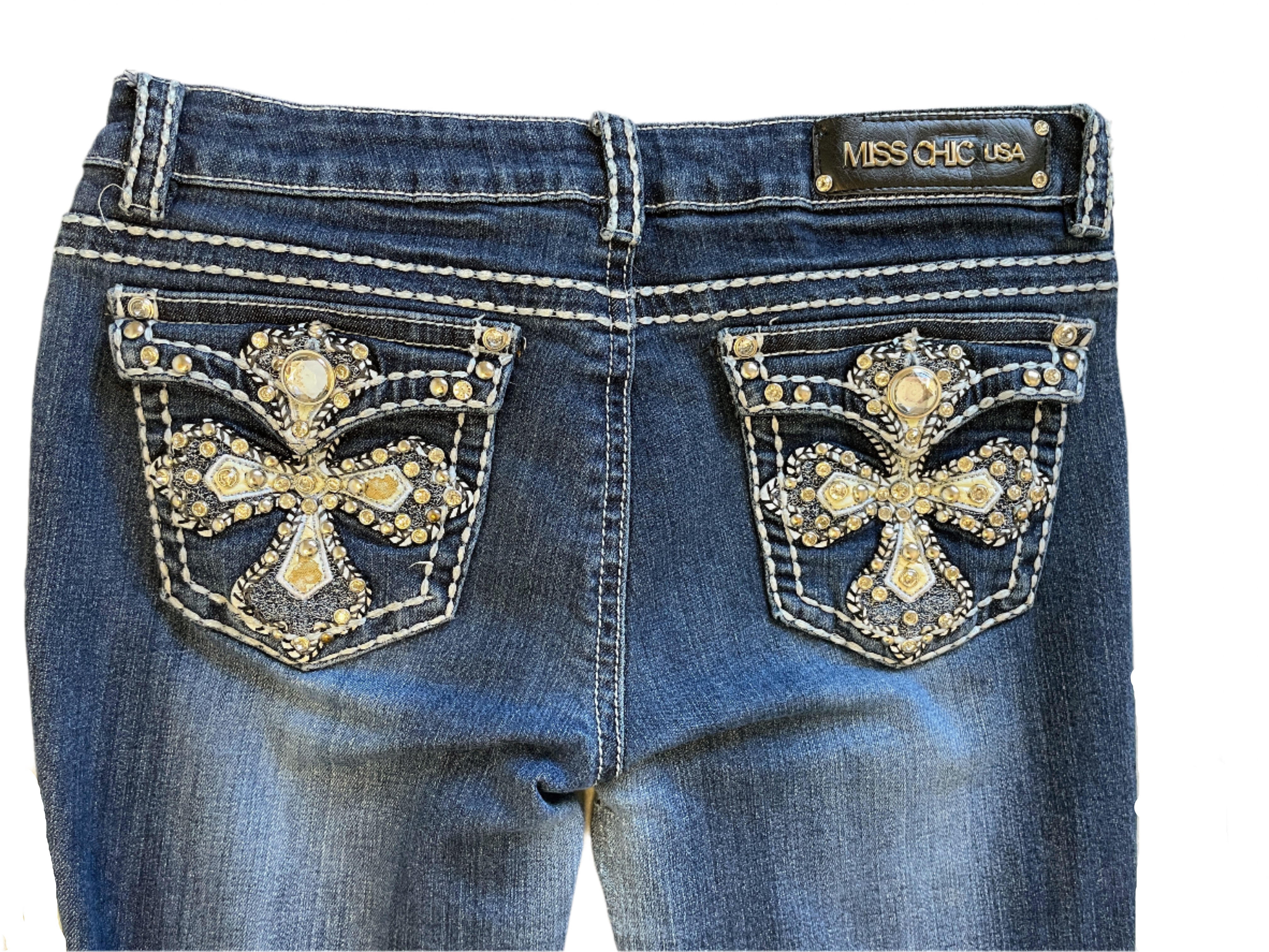 Back view showing jeweled cross back pockets and logo patch